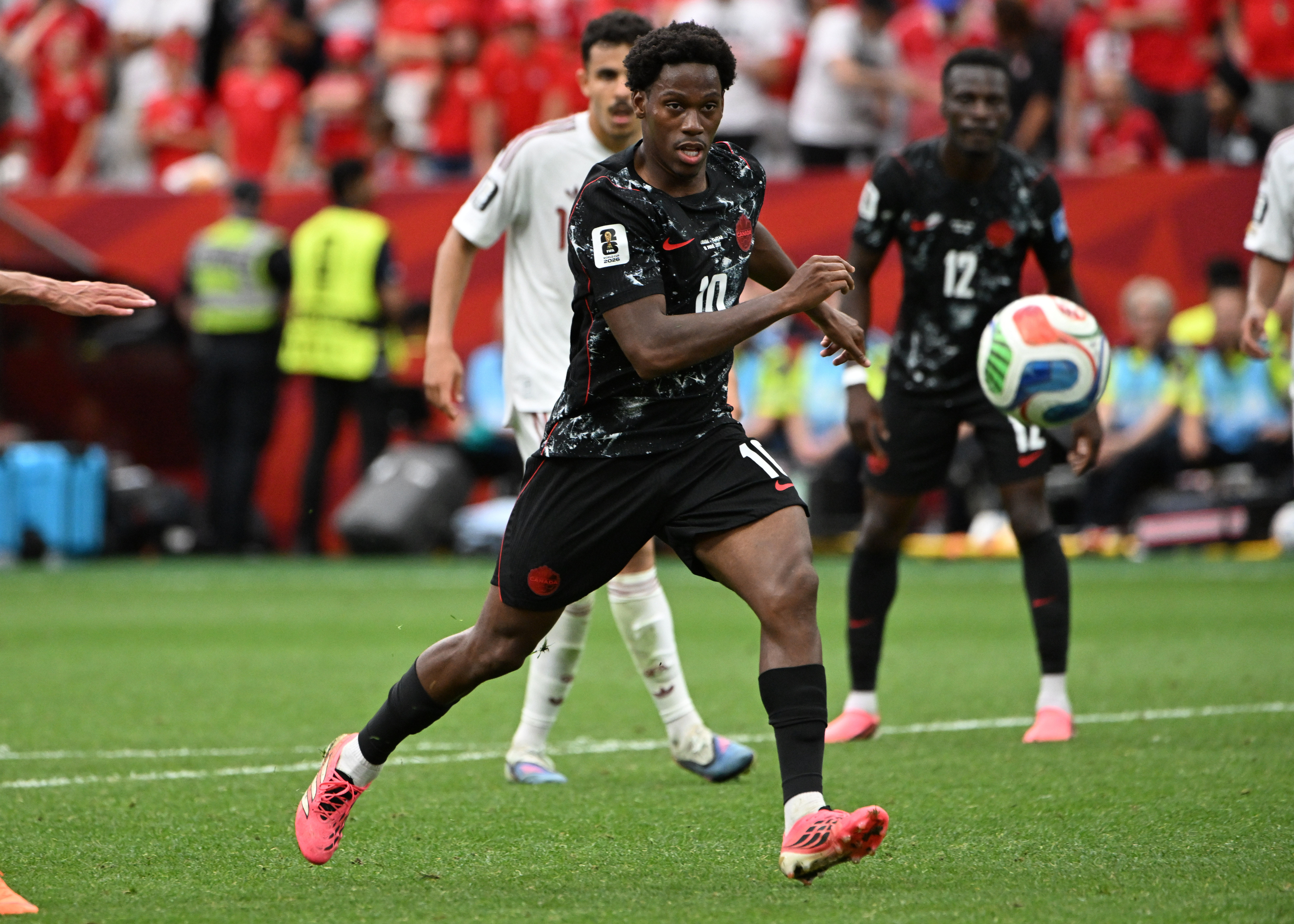 Canada forward Jonathan David (10) has an eye on the ball during the second half against Qatar