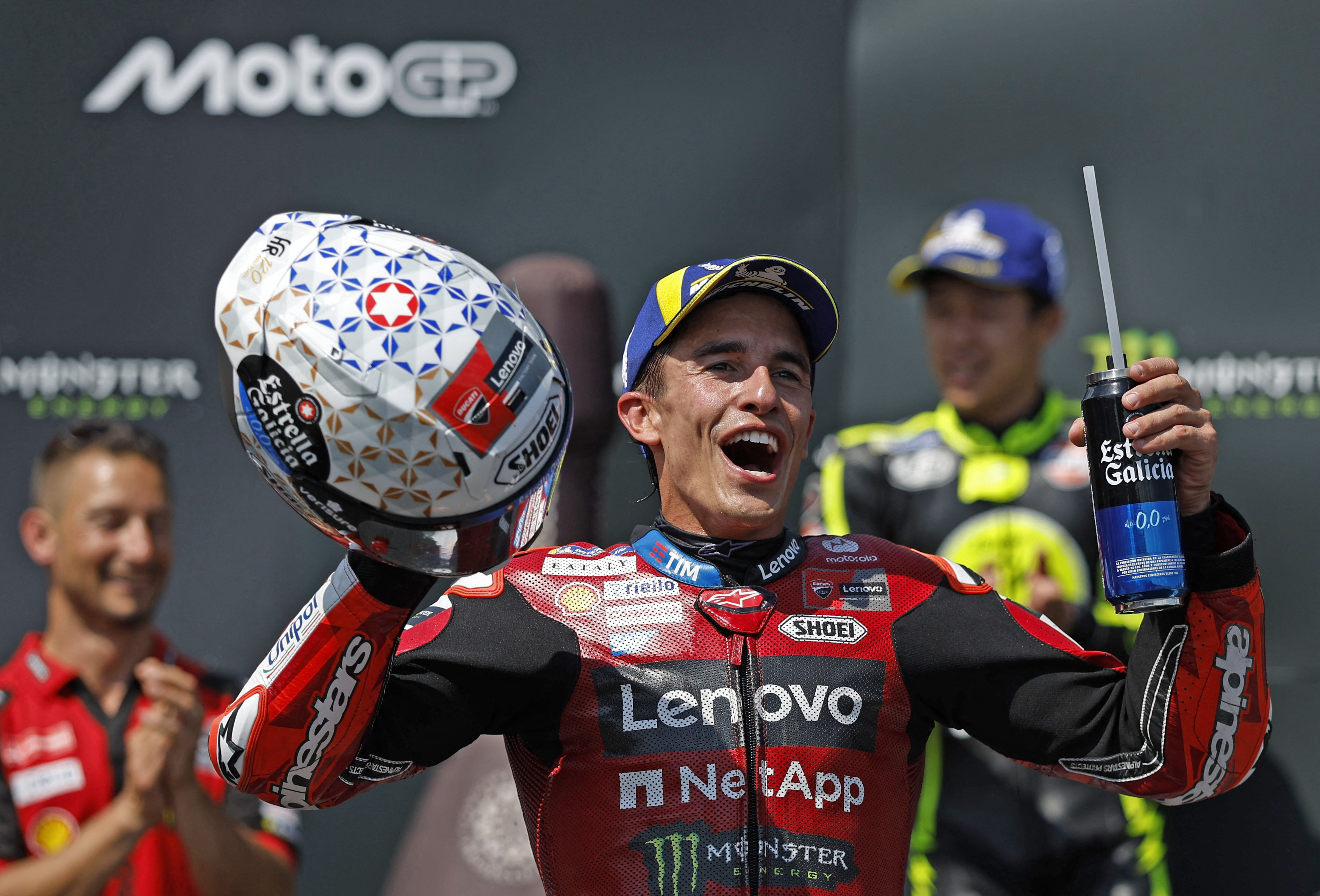 Marc Marquez celebrates on the podium