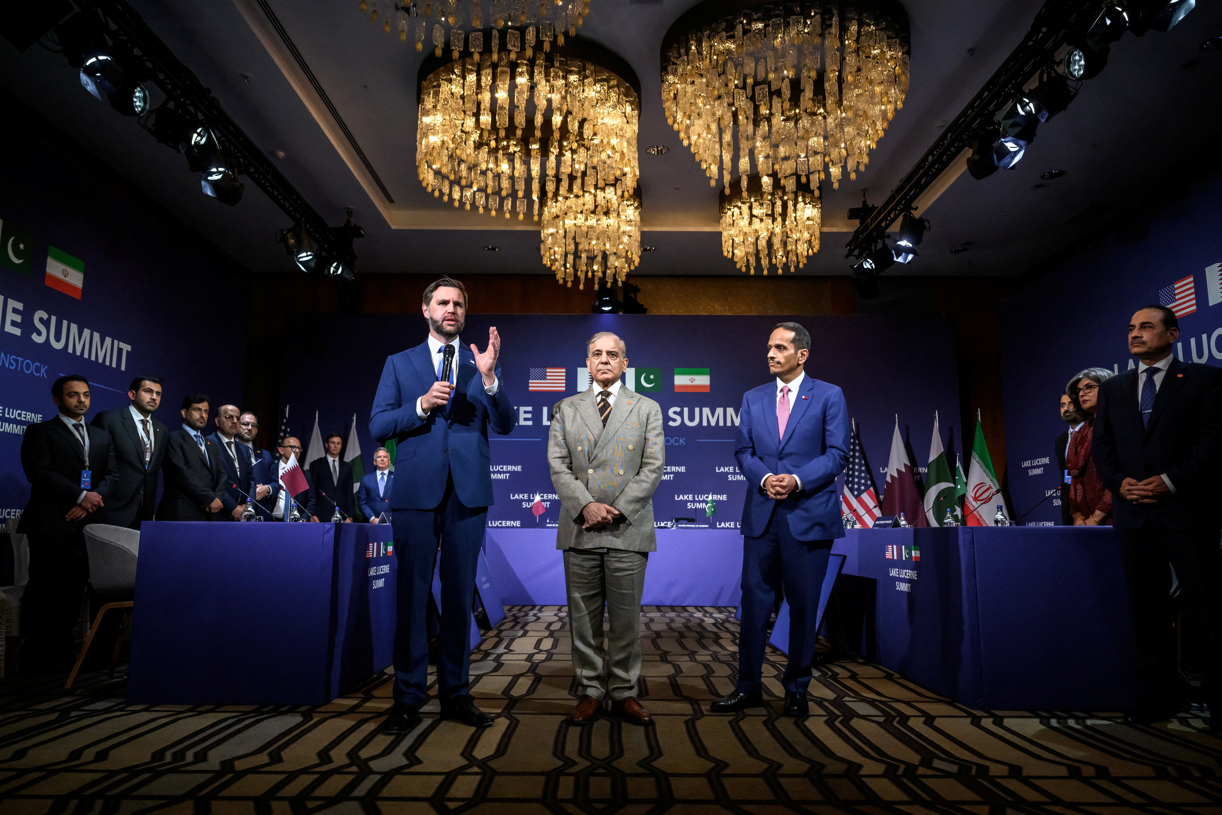 U.S. Vice President JD Vance speaks next to Pakistan's Prime Minister Shehbaz Sharif and Qatar's Prime Minister Sheikh Mohammed bin Abdulrahman bin Jassim al-Thani during a quadrilateral meeting between the United States, Iran, Pakistan and Qatar at the Burgenstock luxury hotel complex overlooking Lake Lucerne, Switzerland, on June 21, 2026. Fabrice Coffrini/Pool via REUTERS
