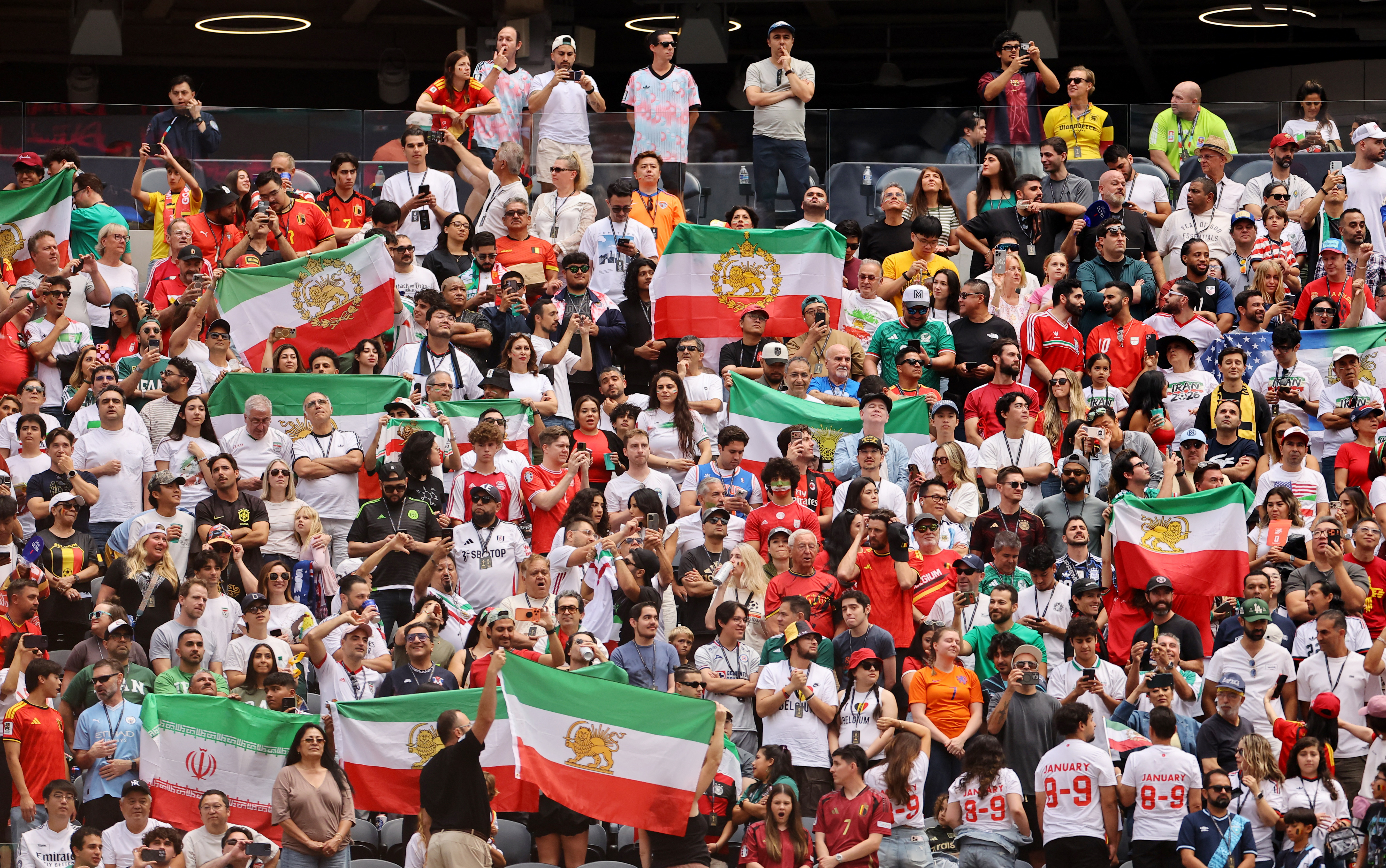 Soccer Football - FIFA World Cup 2026 - Group G - Belgium v Iran - Los Angeles Stadium, Inglewood, California, U.S. - June 21, 2026 Iran fans display pre-Iranian Revolution "Lion and Sun" flags inside the stadium before the match