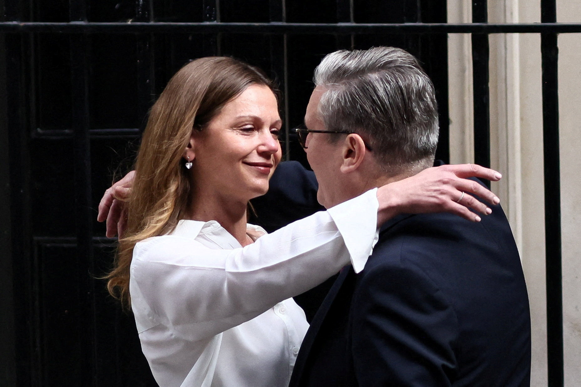 British Prime Minister Keir Starmer embraces his wife, Victoria Starmer, after announcing the timeline for his resignation outside 10 Downing Street, in London, the United Kingdom, on June 22, 2026