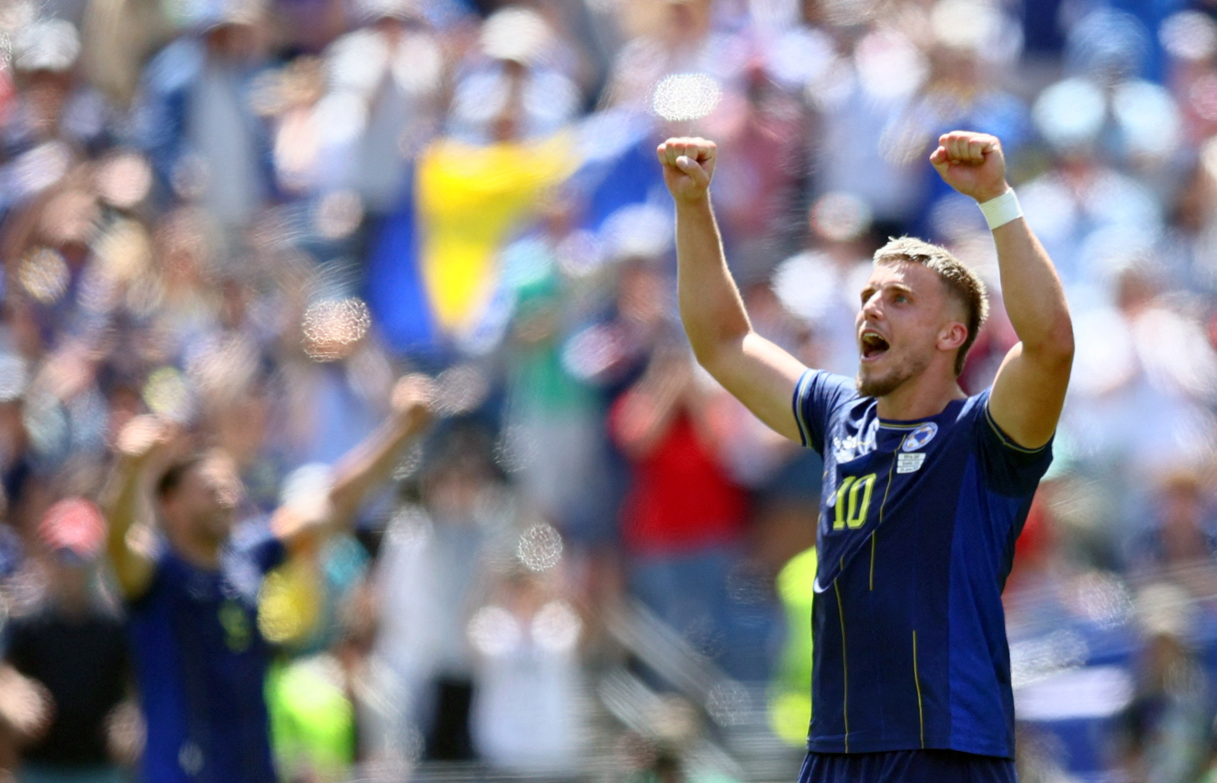 Bosnia and Herzegovina's Ermedin Demirovic celebrates after the match against Qatar