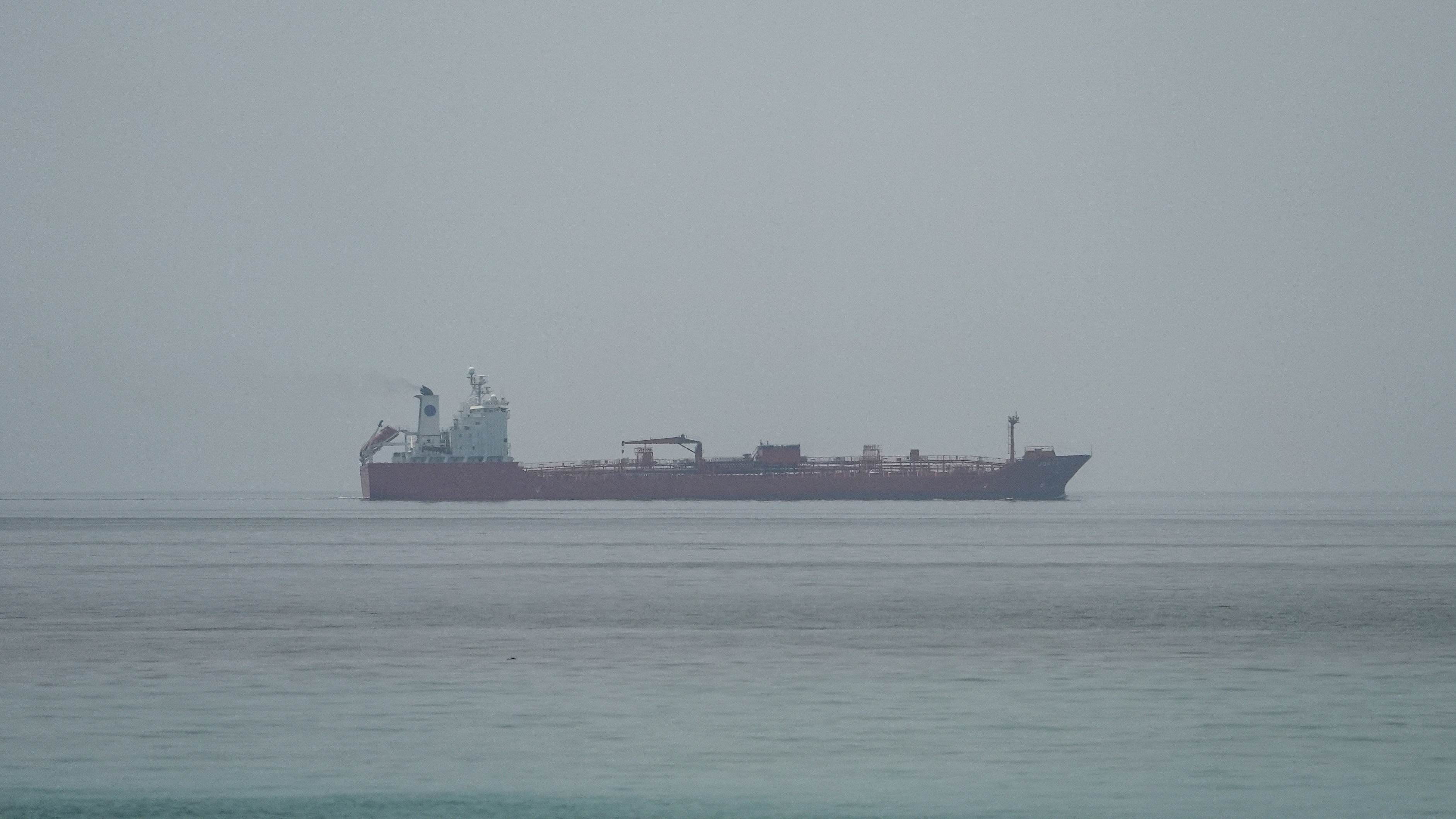 Oil tanker JORYA sails at the sea near the Omani coast, as seen from Musandam, Oman, June 25, 2026. [Stringer/Reuters]