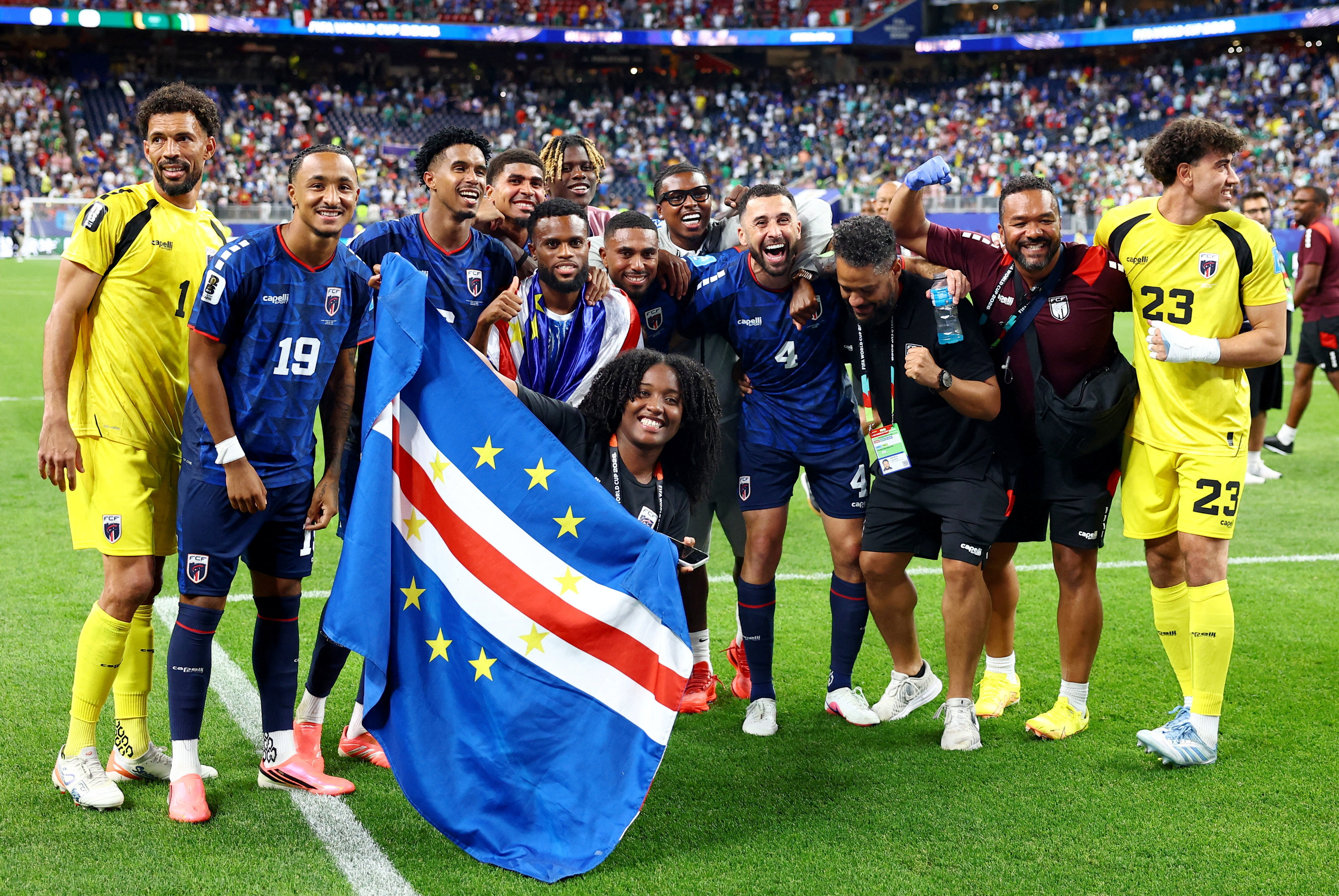 Cape Verde players and staff celebrate after the Saudi Arabia match match as Cape Verde qualify for the knockout stages of the World Cup