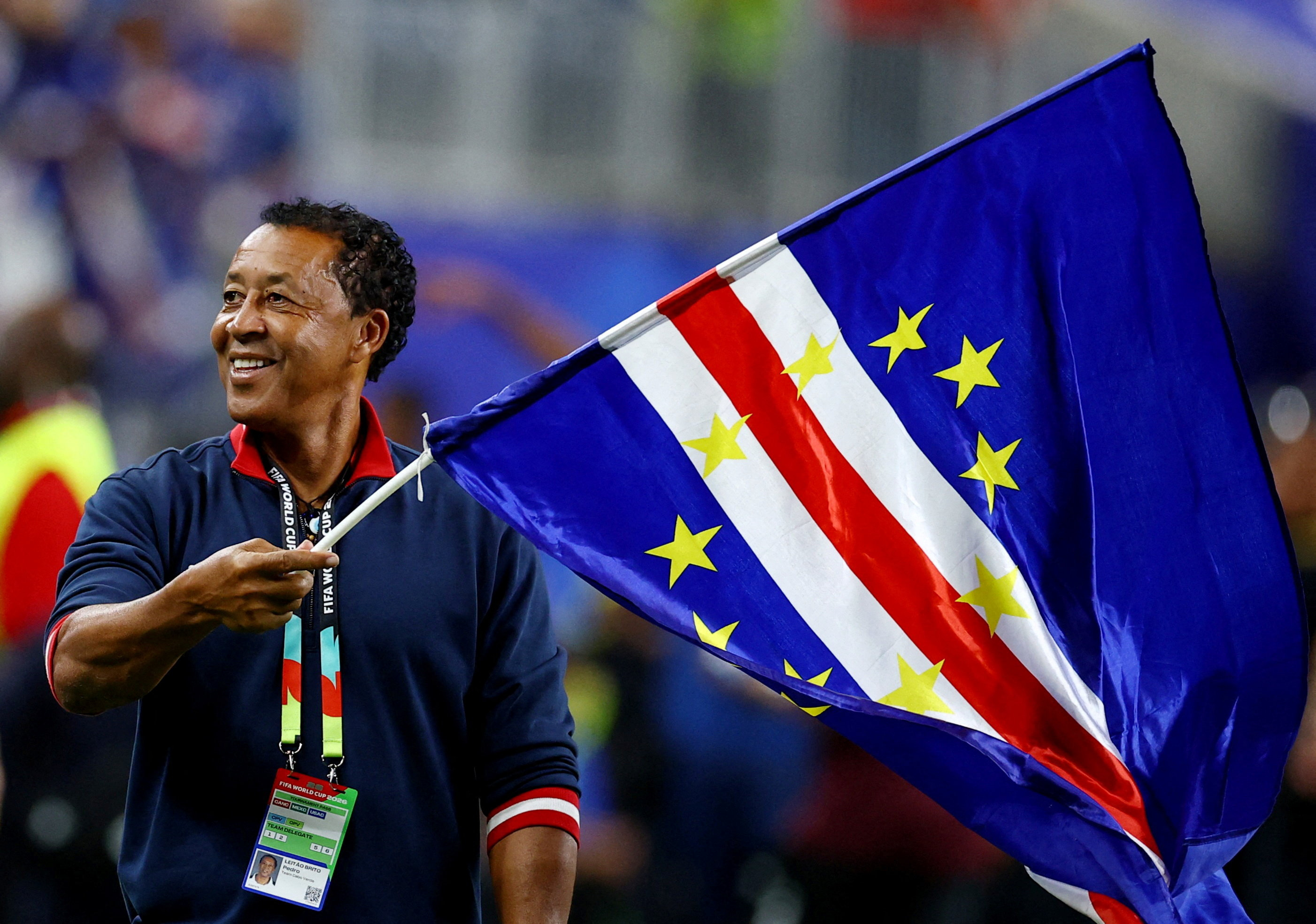 Cape Verde coach Pedro Brito celebrates after the match as Cape Verde qualify for the knockout stages of the World Cup