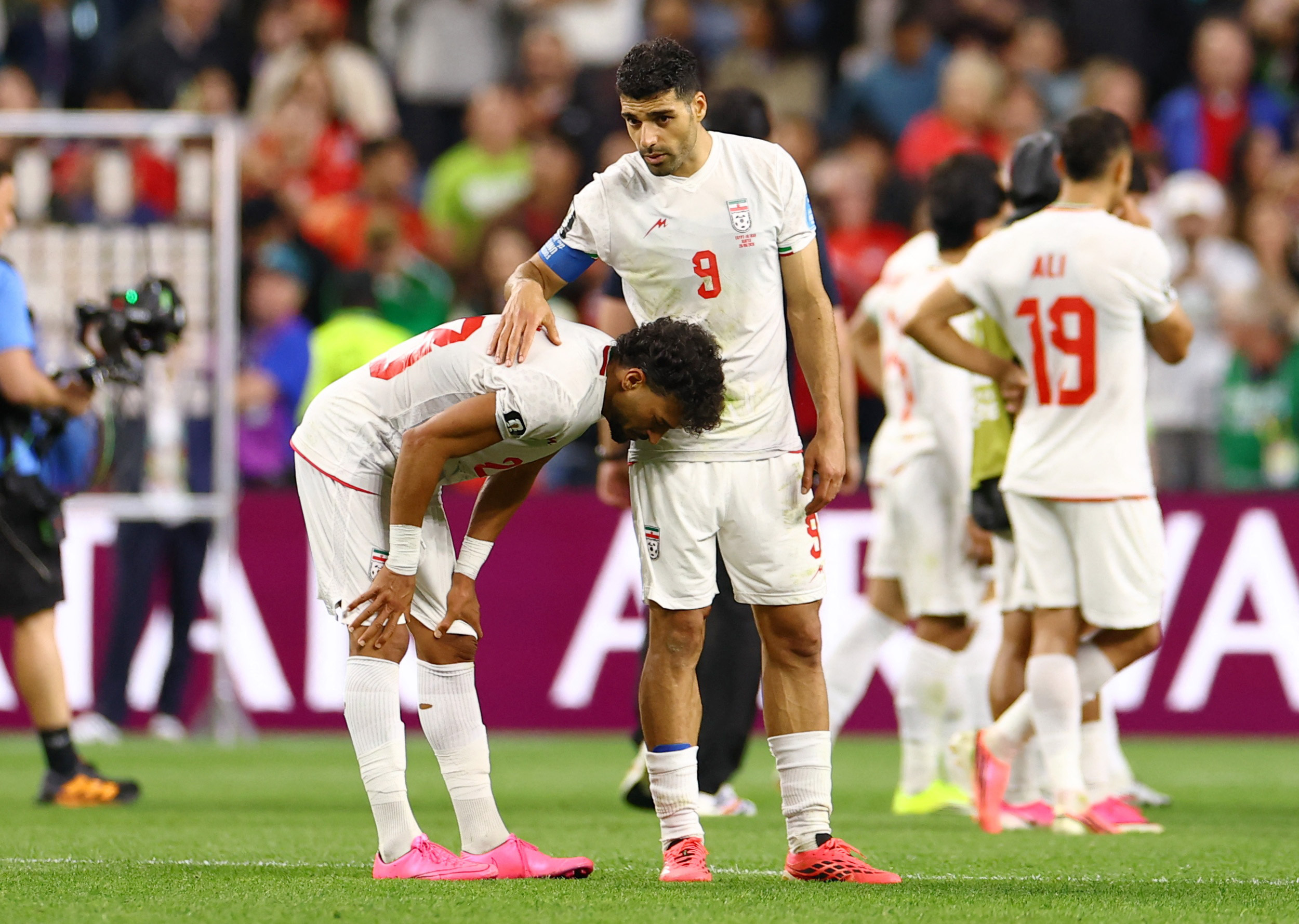 Soccer Football - FIFA World Cup 2026 - Group G - Egypt v Iran - Seattle Stadium, Seattle, Washington, U.S. - June 26, 2026 Iran's Ramin Rezaeian and Mehdi Taremi look dejected after the match REUTERS/Carlos Barria