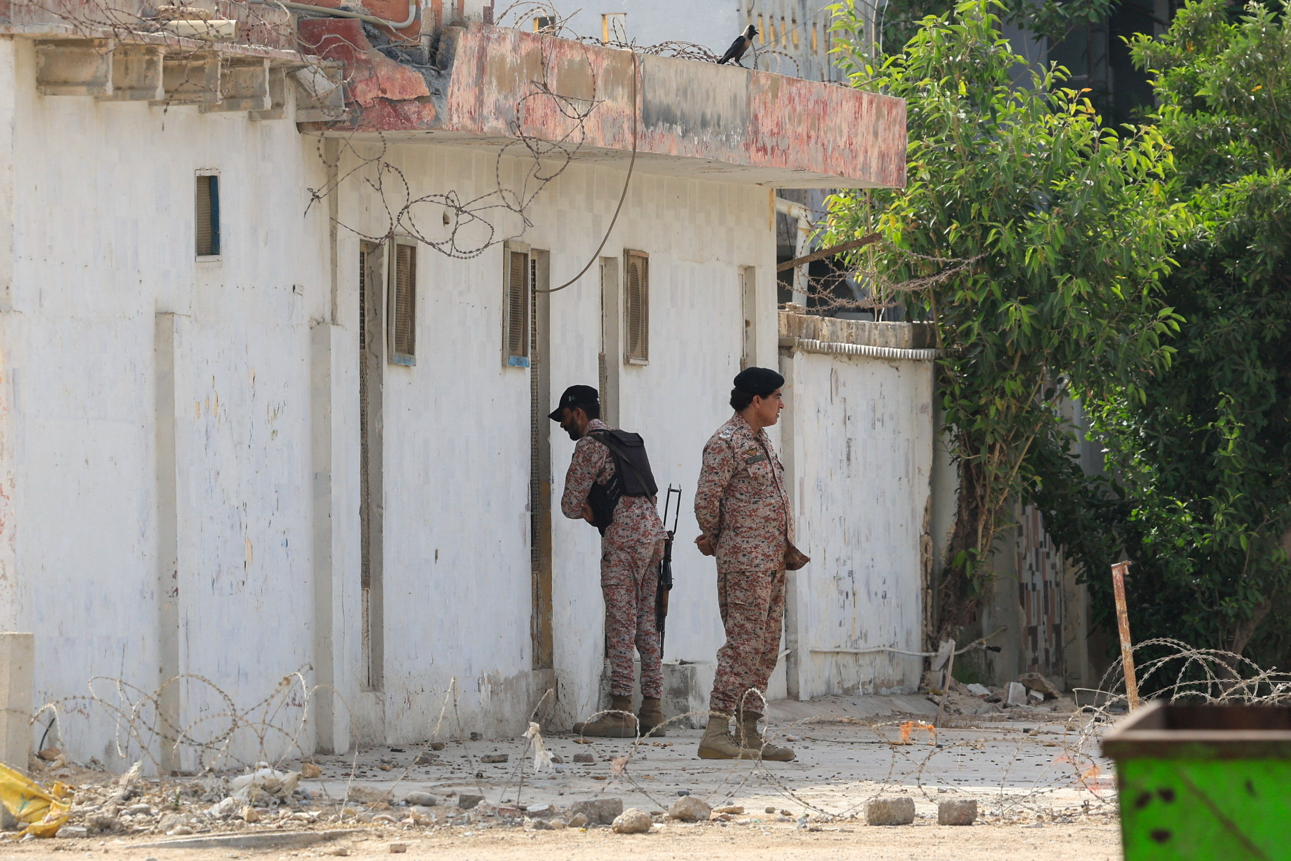 Paramilitary soldiers stand guard outside the office of the Rangers, a paramilitary force, following an explosion and gunfire reported on Saturday night in Karachi, Pakistan, June 28, 2026. REUTERS/Akhtar Soomro