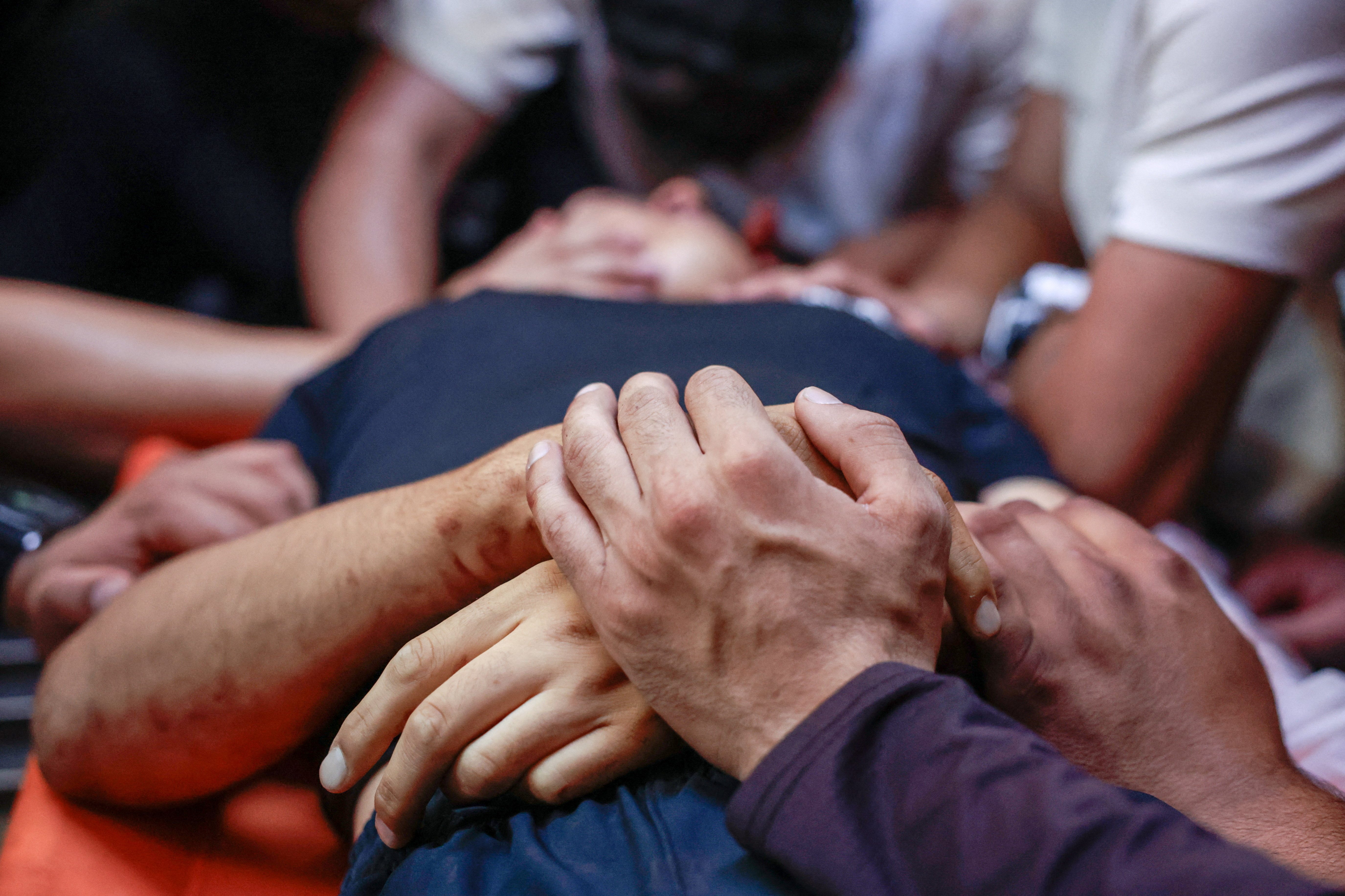 People mourn over the body of a 15-year-old Palestinian boy killed by Israeli forces during a raid, at a hospital in Ramallah in the Israeli-occupied West Bank, June 29, 2026. [Mohammed Torokman/Reuters]