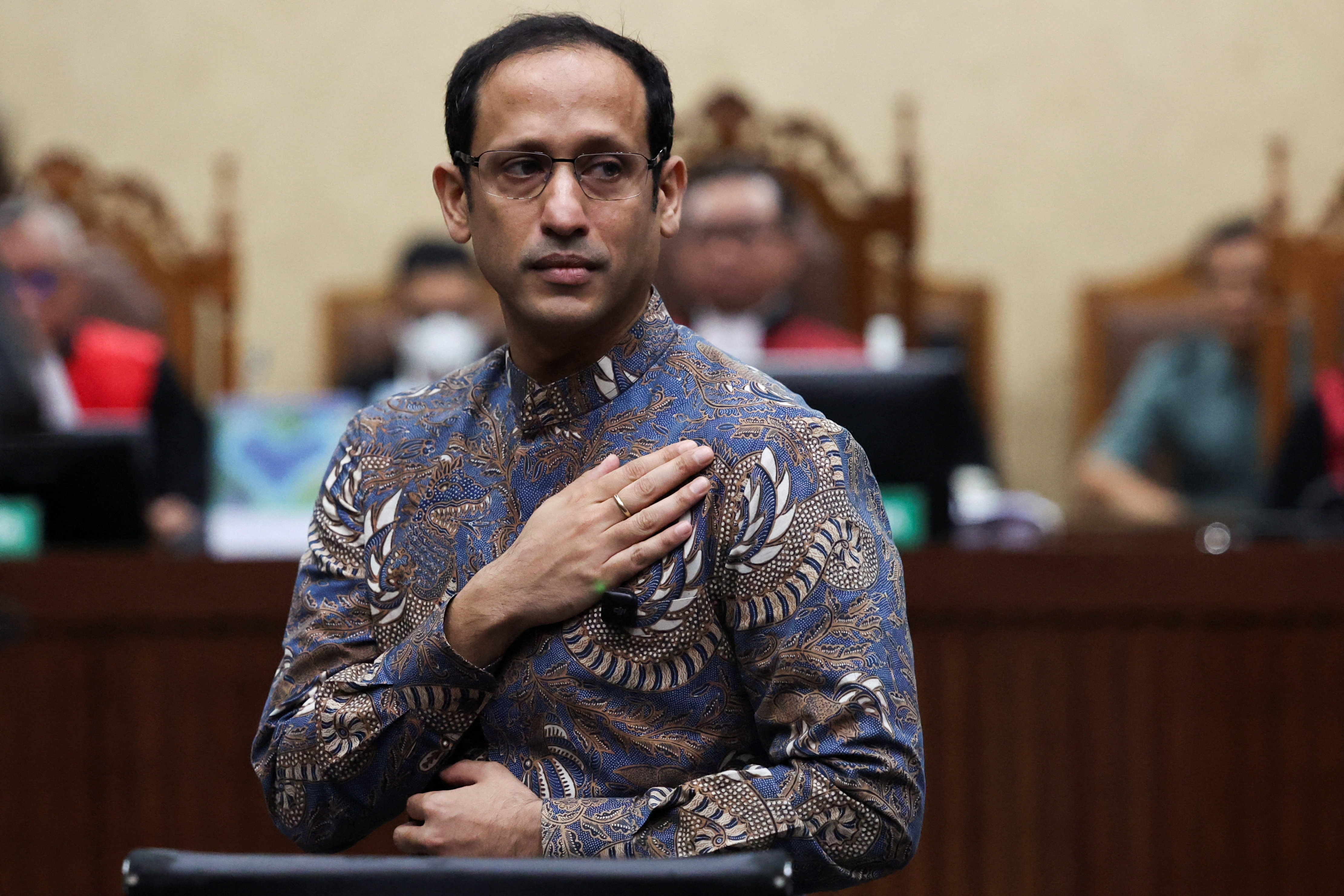 Nadiem Makarim gestures during his verdict hearing at a court in Jakarta