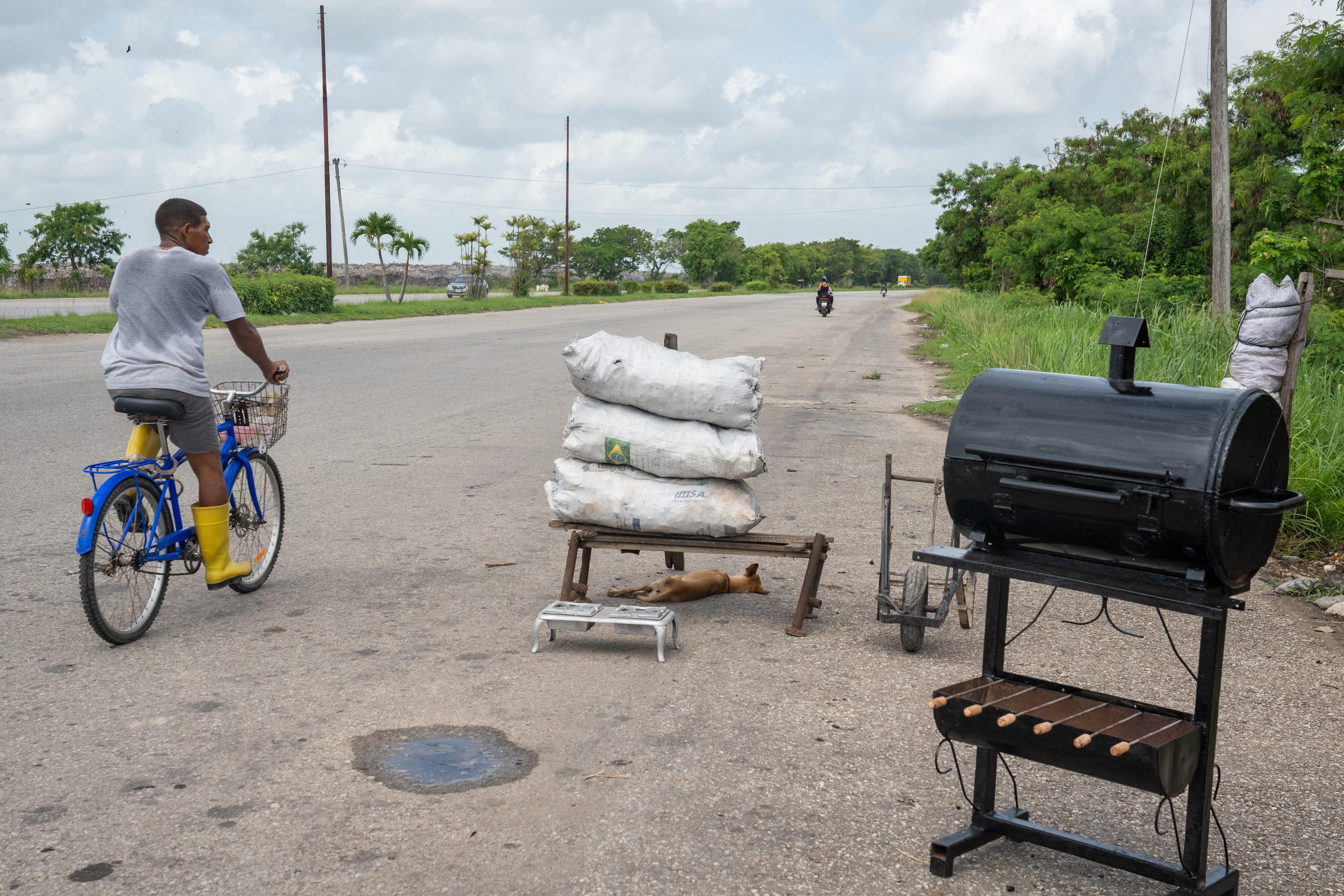 Bags of charcoal and charcoal stoves are displayed for sale along a roadside in Cotorro, on the outskirts of Havana.