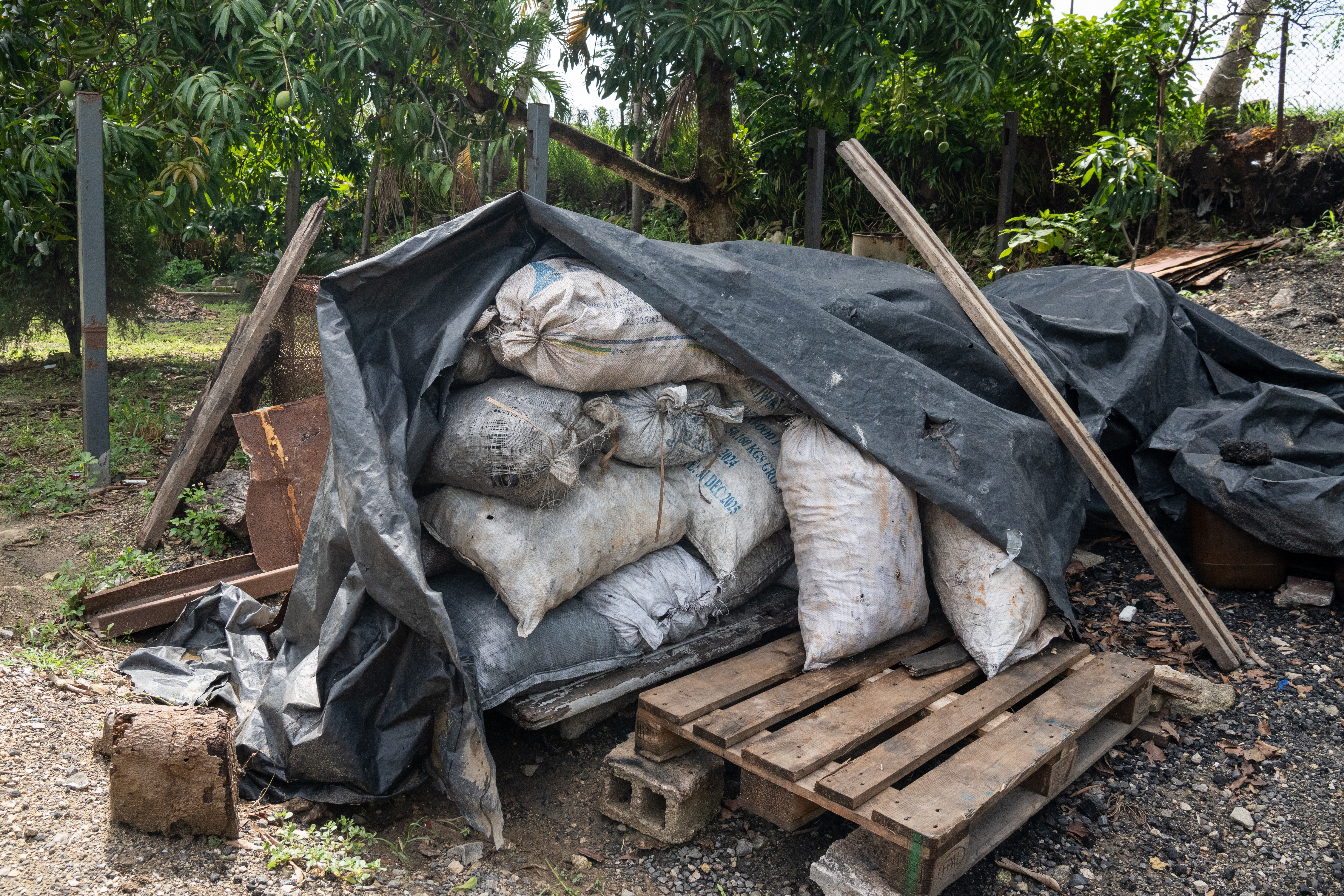 Bags of charcoal stored by Lazaro Martinez, a charcoal vendor near Cotorro on the outskirts of Havana.