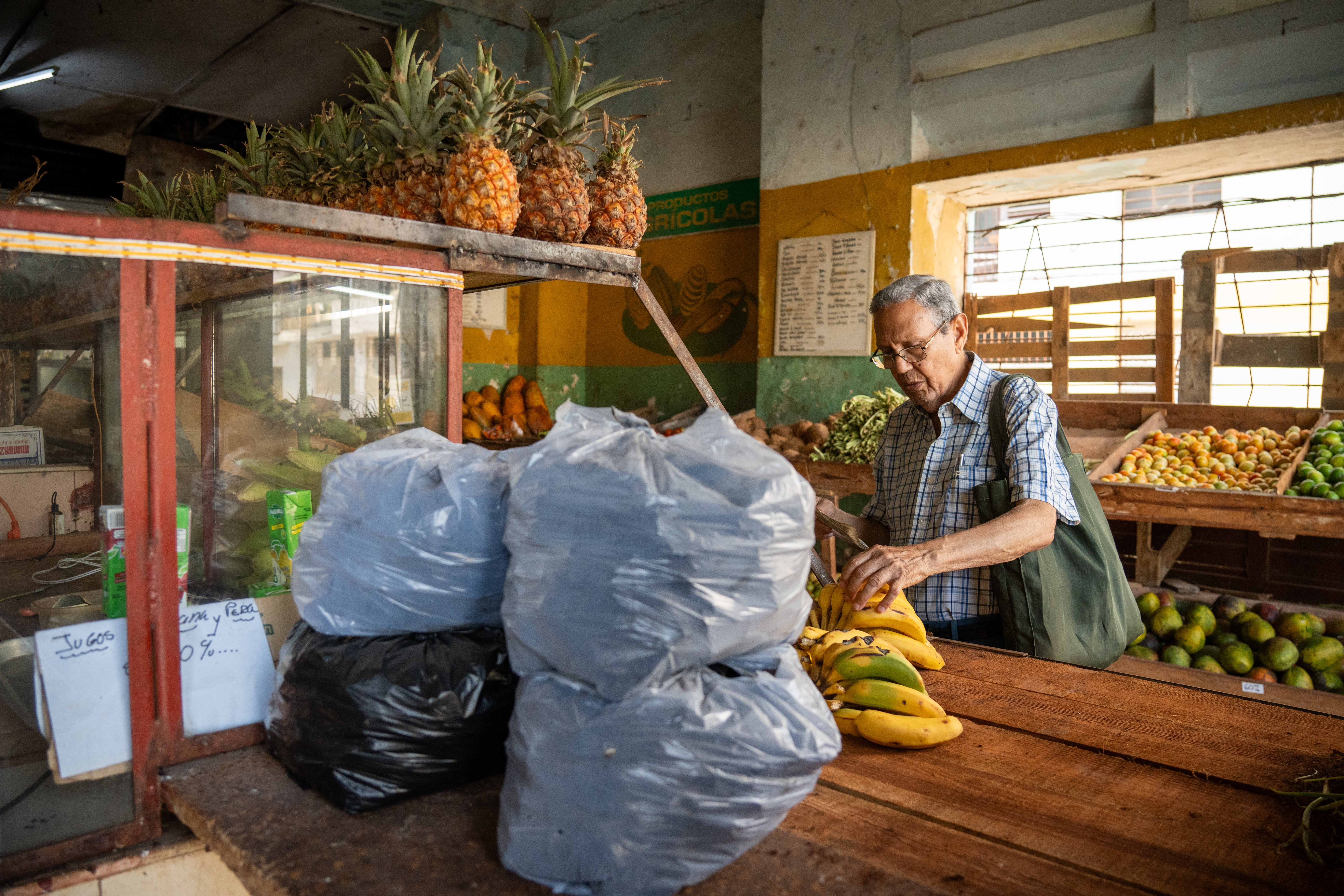 Bags of charcoal are displayed for sale in a grocery store in Centro Habana.