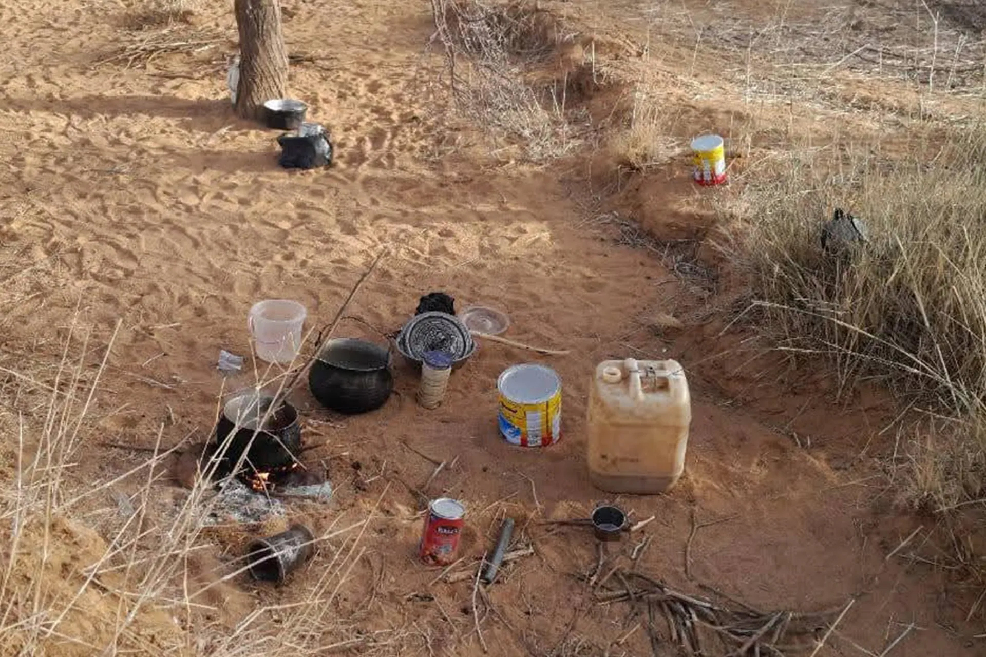 The modest belongings of displaced people in a valley near Tine represent all that remains of their lives following the burning and looting of Orchi.