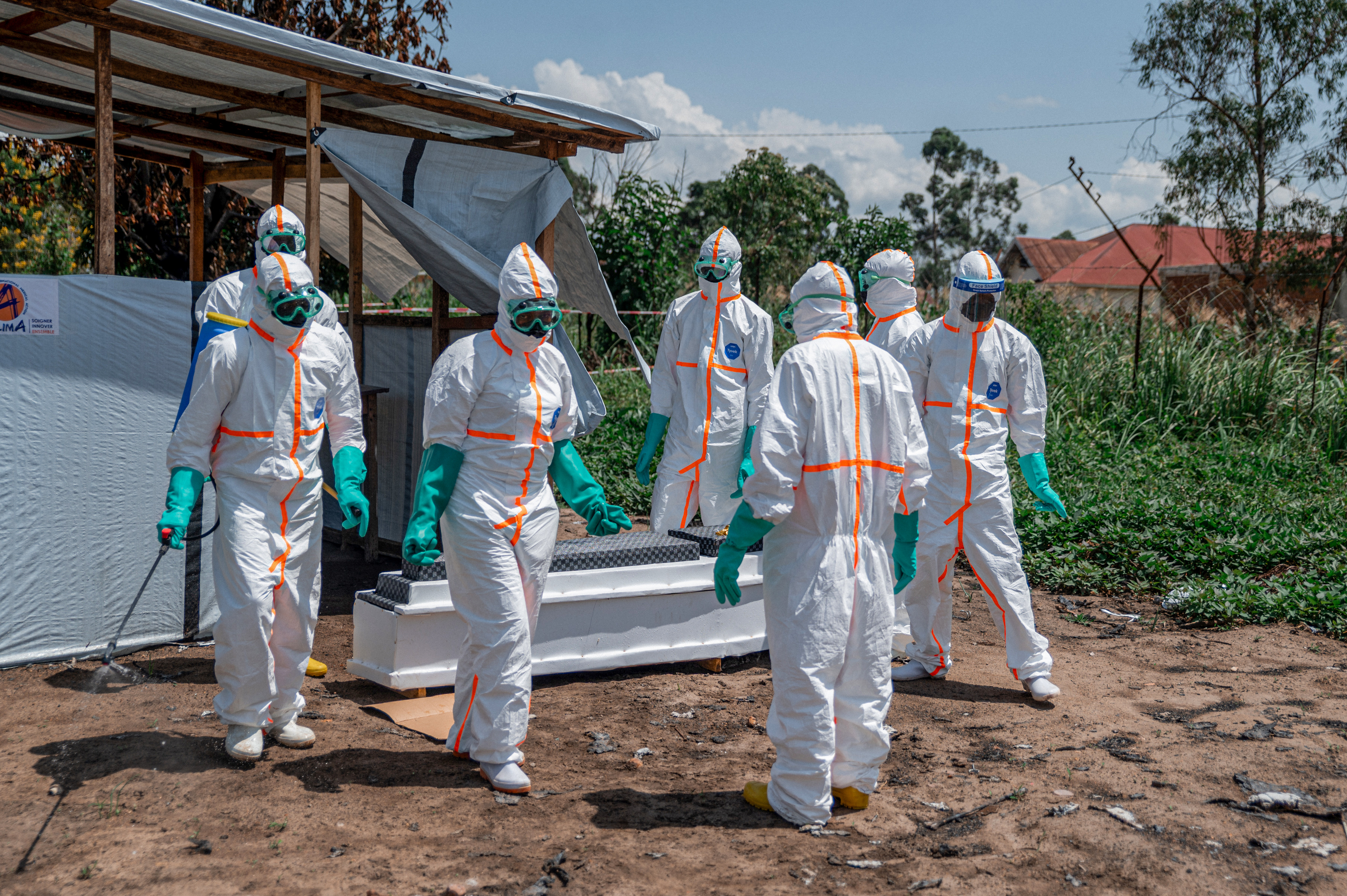 ITURI, DEMOCRATIC REPUBLIC OF THE CONGO - JUNE 09: Health workers, wearing protective gear, retrieve the body of a citizen who died of Ebola virus from the Rwampara Hospital morgue for burial procedures, as teams carry out disinfection work at the hospital, considered the epicenter of the outbreak, in the Ituri province of the Democratic Republic of the Congo on June 09, 2026. ( Stringer - Anadolu Agency )