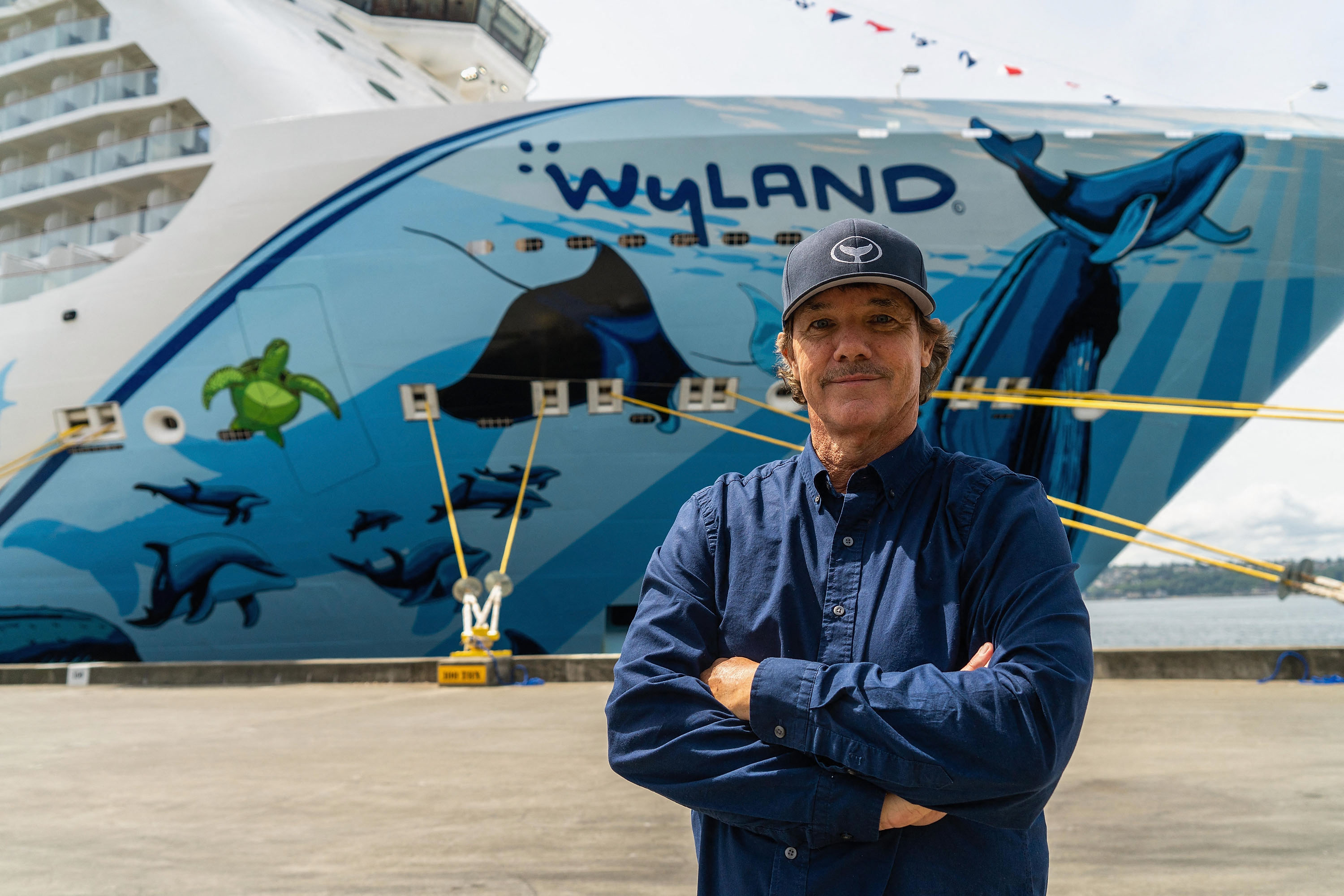 SEATTLE, WA - MAY 30: Wyland, artist of the Norwegian Bliss hull and conservationist, poses for a photo at Pier 66 on May 30, 2018 in Seattle, Washington. Suzi Pratt/Getty Images for Norwegian Cruise Line/AFP (Photo by Suzi Pratt / GETTY IMAGES NORTH AMERICA / Getty Images via AFP)