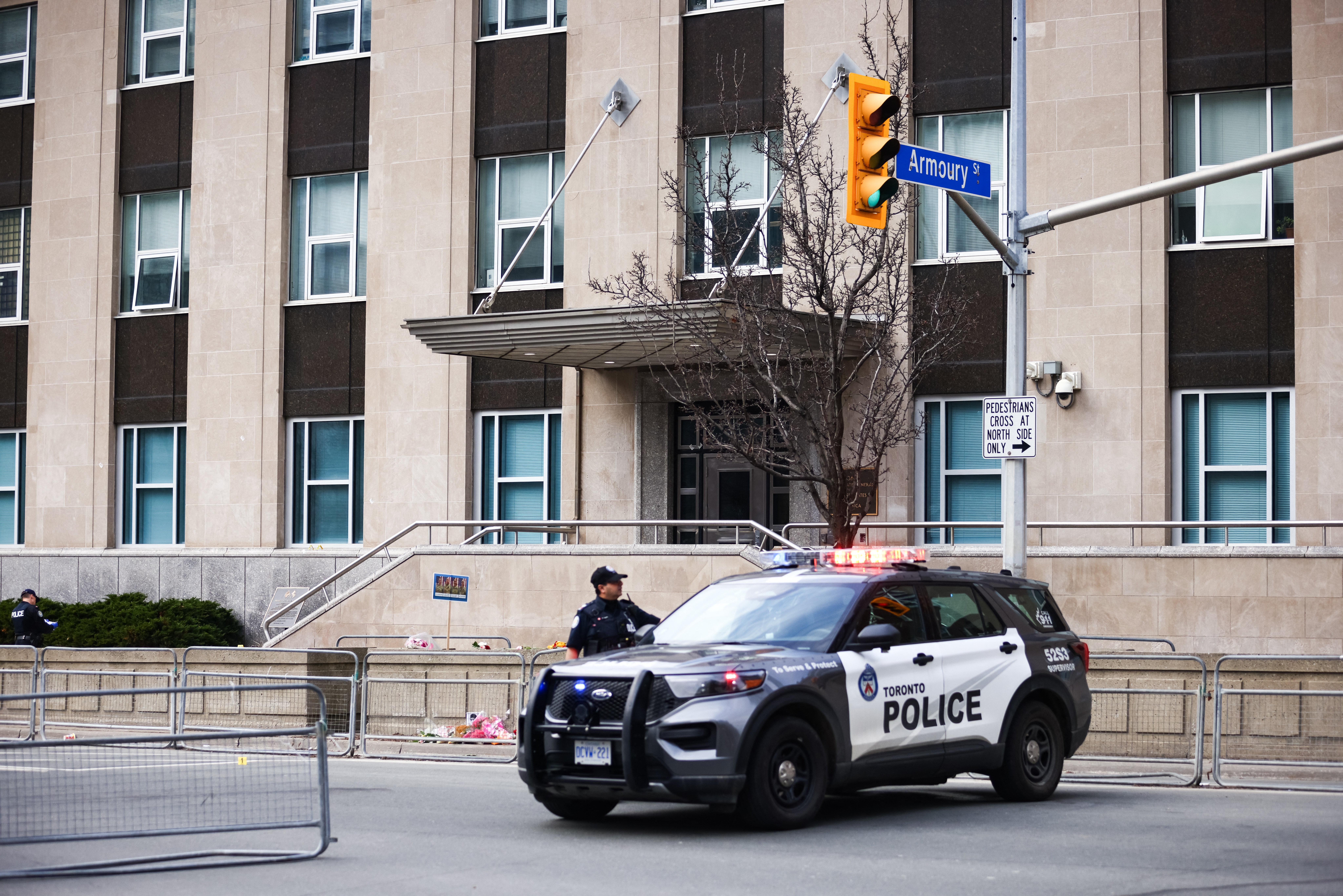 a police car outside of a US consulate
