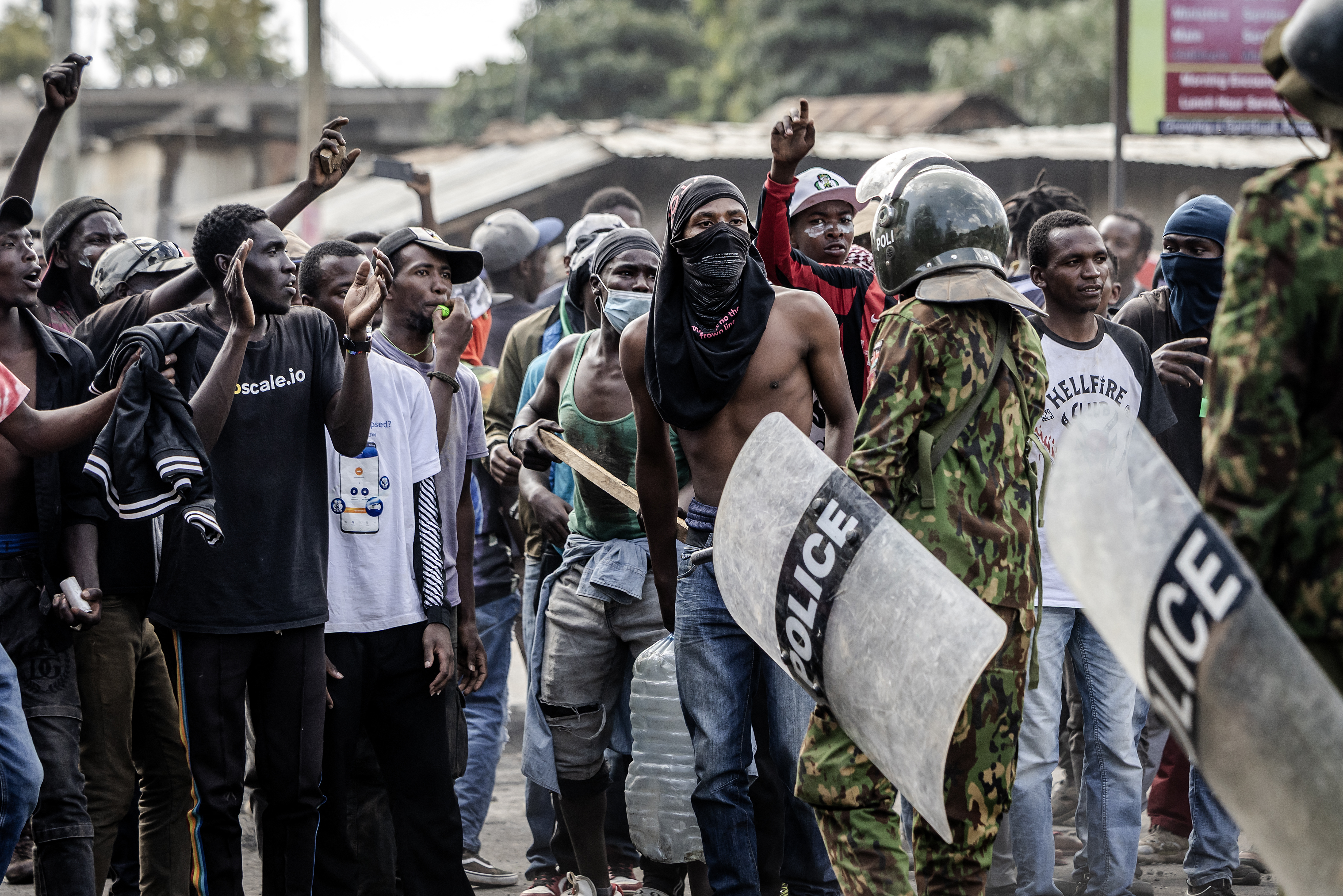 Demonstrators chant slogans as they confront Kenyan police officers during clashes at a demonstration against a controversial US-built Ebola quarantine centre slated to begin operations at Laikipia Air Base in Nanyuki on June 9, 2026. Several Kenyans were arrested on June 9, 2026 in the latest protests against an Ebola quarantine centre being built for US citizens in a tourist town.The centre at Laikipia Air Base in the town of Nanyuki, under the shadow of Mount Kenya, is set to quarantine Americans arriving from the Democratic Republic of Congo (DRC), which is battling a major Ebola outbreak. (Photo by Luis TATO / AFP)
