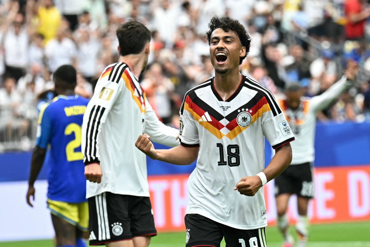 Germany's defender #18 Nathaniel Brown celebrates after scoring a goal during the 2026 World Cup Group E football match between Germany and Curacao