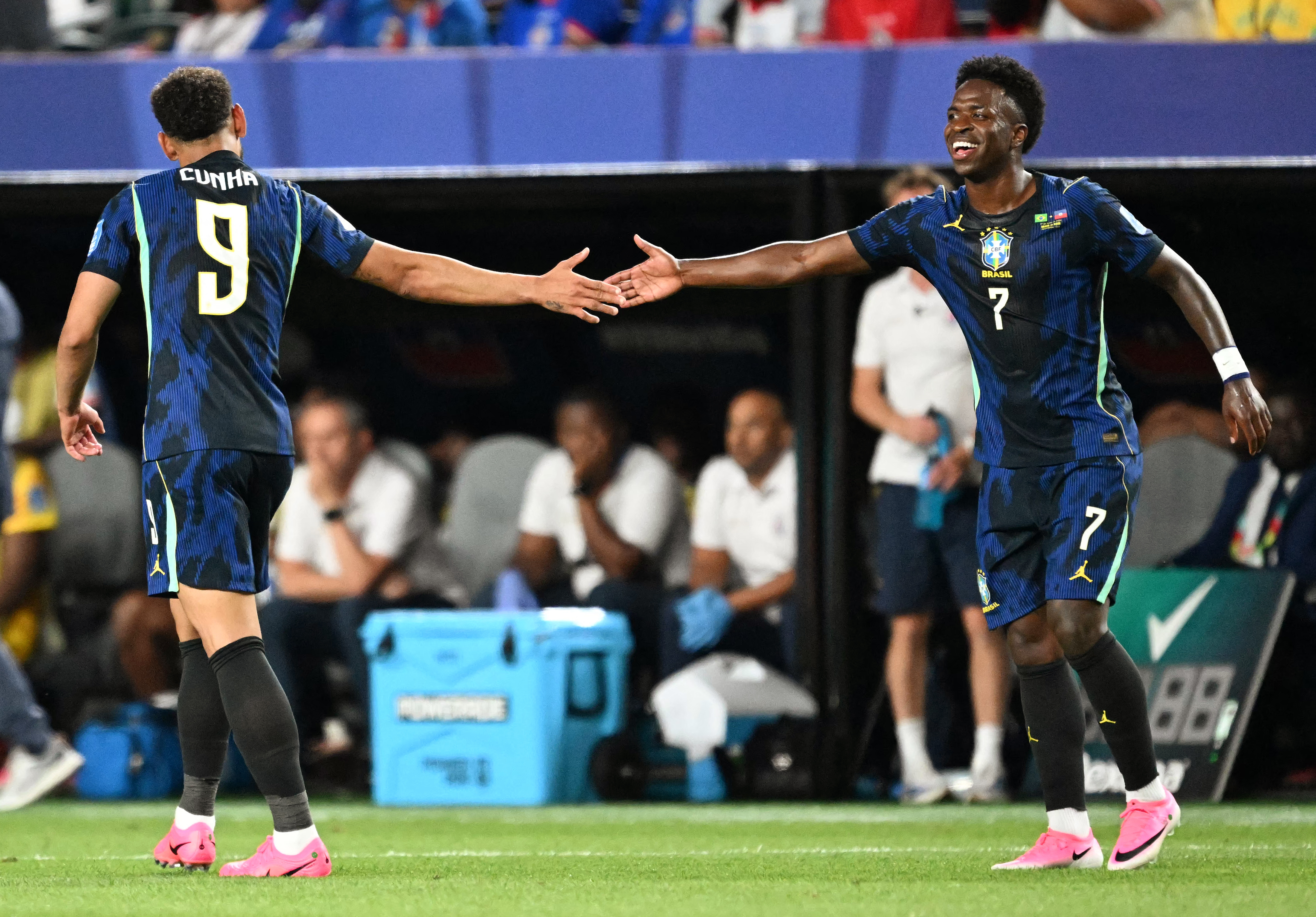 Brazil's forward #09 Matheus Cunha celebrates scoring his team's second goal with teammate forward #07 Vinicius Junior during the 2026 World Cup Group C football match between Brazil and Haiti at the Philadelphia Stadium in Philadelphia on June 19, 2026. (Photo by ROBERTO SCHMIDT / AFP)