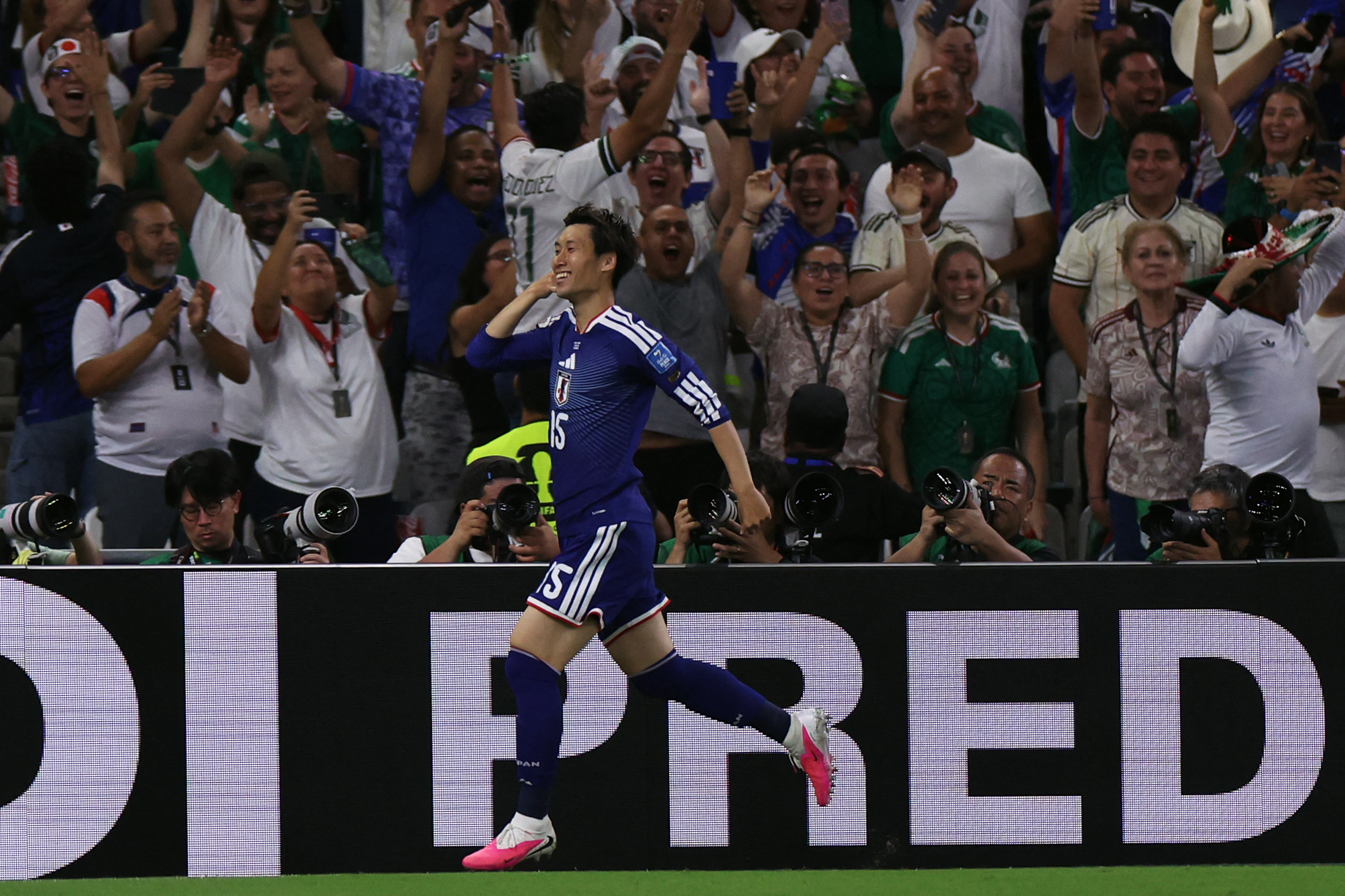 Japan's midfielder #15 Daichi Kamada celebrates after scoring his team first goal during the 2026 World Cup Group F football match between Tunisia and Japan at the Monterrey Stadium in Guadalupe, Mexico, on June 20, 2026. (Photo by Julio Cesar AGUILAR / AFP)