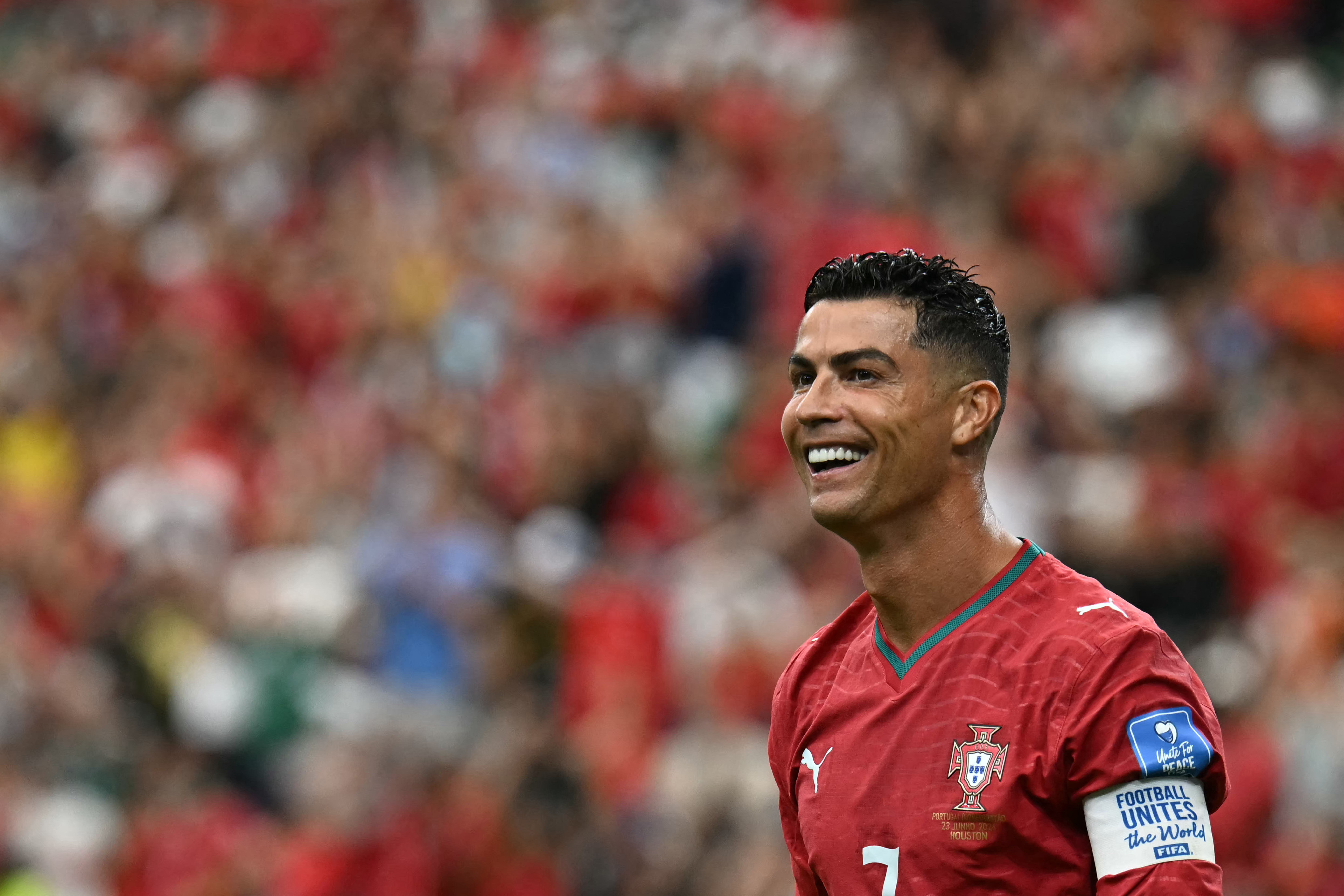 Portugal's forward #07 Cristiano Ronaldo reacts to his team's fourth goal during the 2026 World Cup Group K football match between Portugal and Uzbekistan at the Houston Stadium in Houston on June 23, 2026. (Photo by Paul ELLIS / AFP)