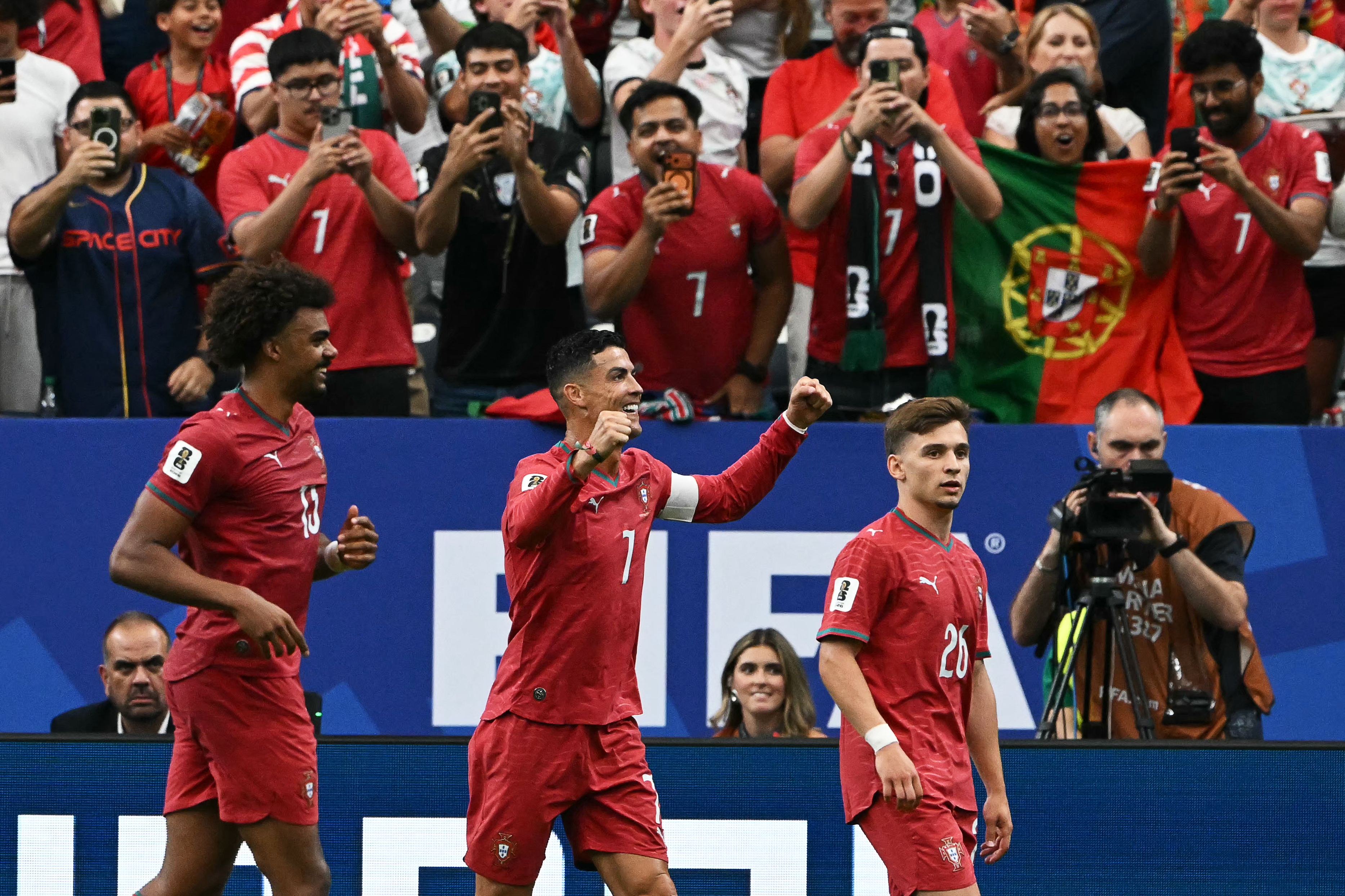 Portugal's forward #07 Cristiano Ronaldo (C) celebrates after his team's fourth goal during the 2026 World Cup Group K football match between Portugal and Uzbekistan at the Houston Stadium in Houston on June 23, 2026. (Photo by RONALDO SCHEMIDT / AFP)