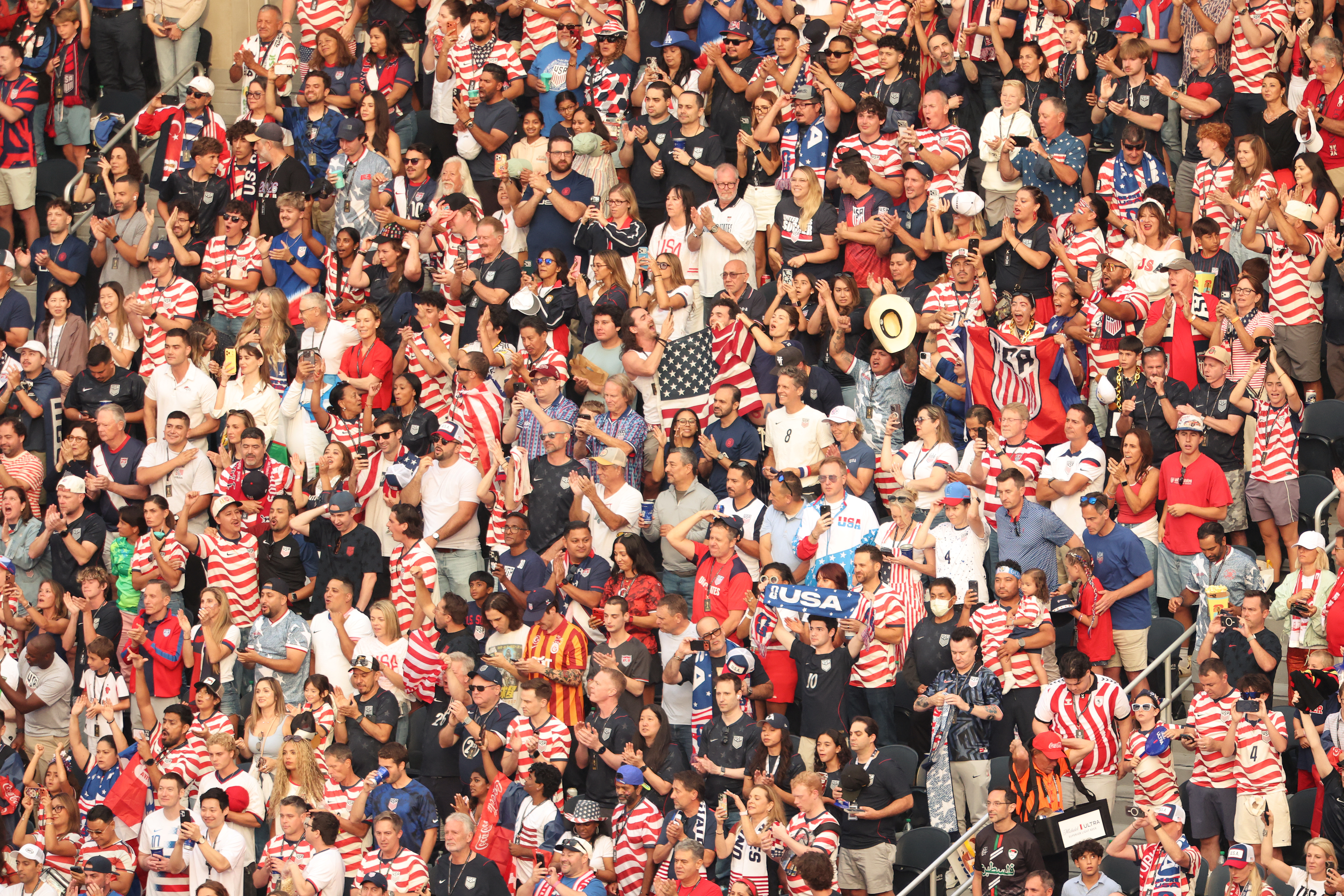 US fans cheer their team ahead of the 2026 World Cup Group D football match between Turkey and USA at the Los Angeles Stadium in Inglewood on June 25, 2026. (Photo by Etienne LAURENT / AFP)