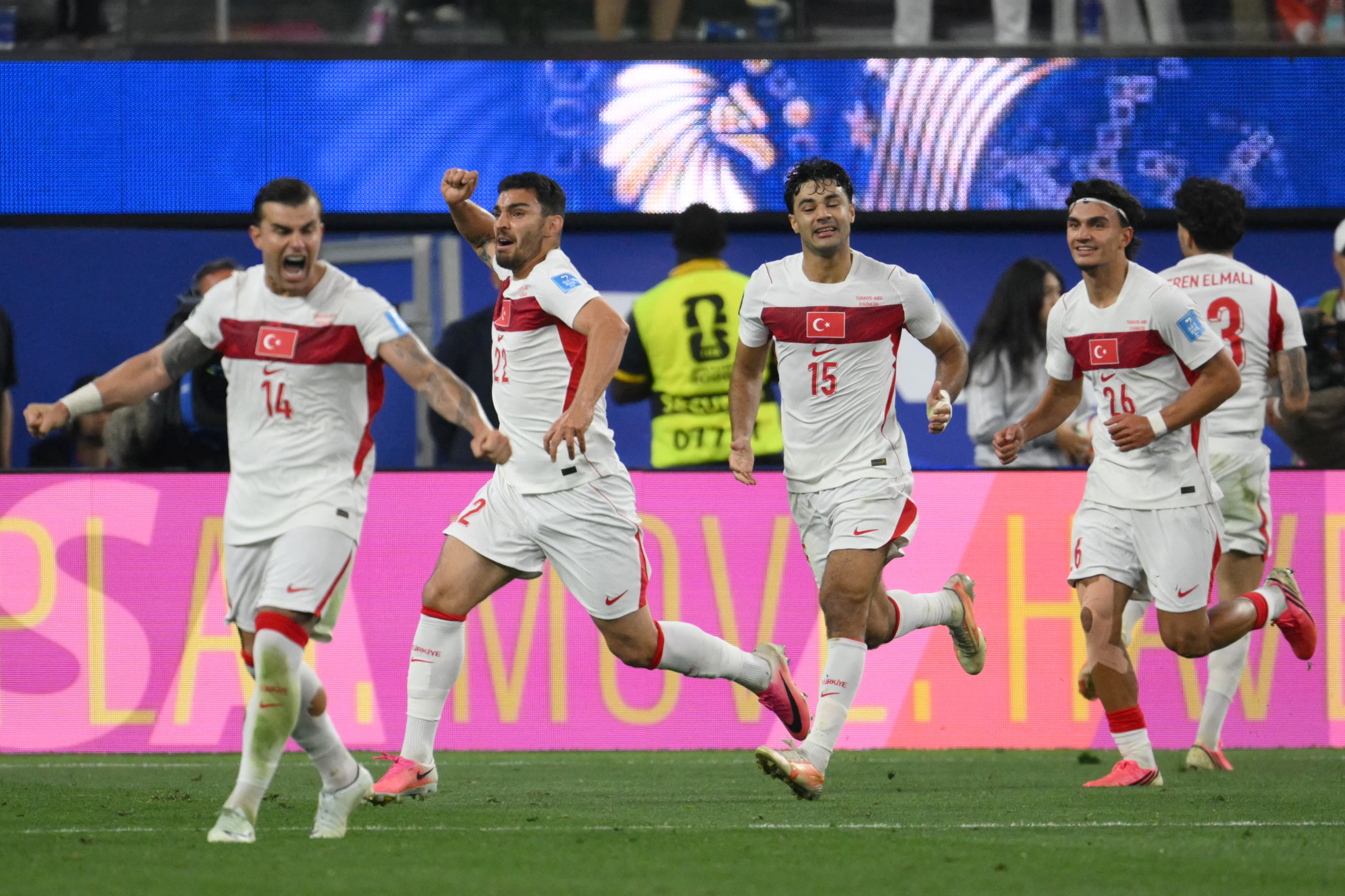Turkey's defender #22 Kaan Ayhan (2nd L) celebrates after scoring his teams third goal during the 2026 World Cup Group D football match between Turkey and USA at the Los Angeles Stadium in Inglewood on June 25, 2026. (Photo by Patrick T. FALLON / AFP)