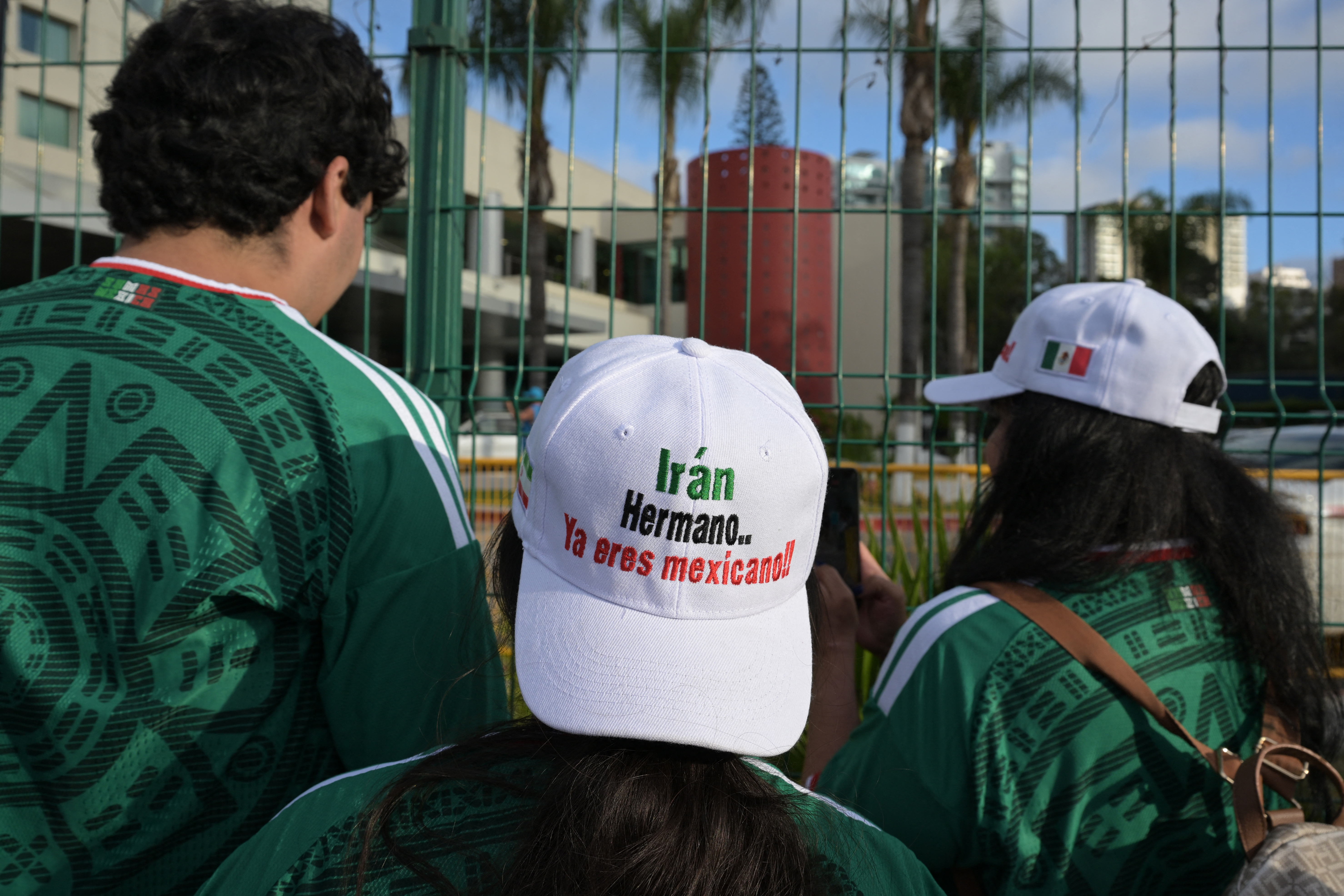 Iran fans wear caps reading Iran, brother, youre Mexican now while waiting for the team at the Marriott Hotel in Tijuana, Mexico, on June 27, 2026. (Photo by Guillermo Arias / AFP)