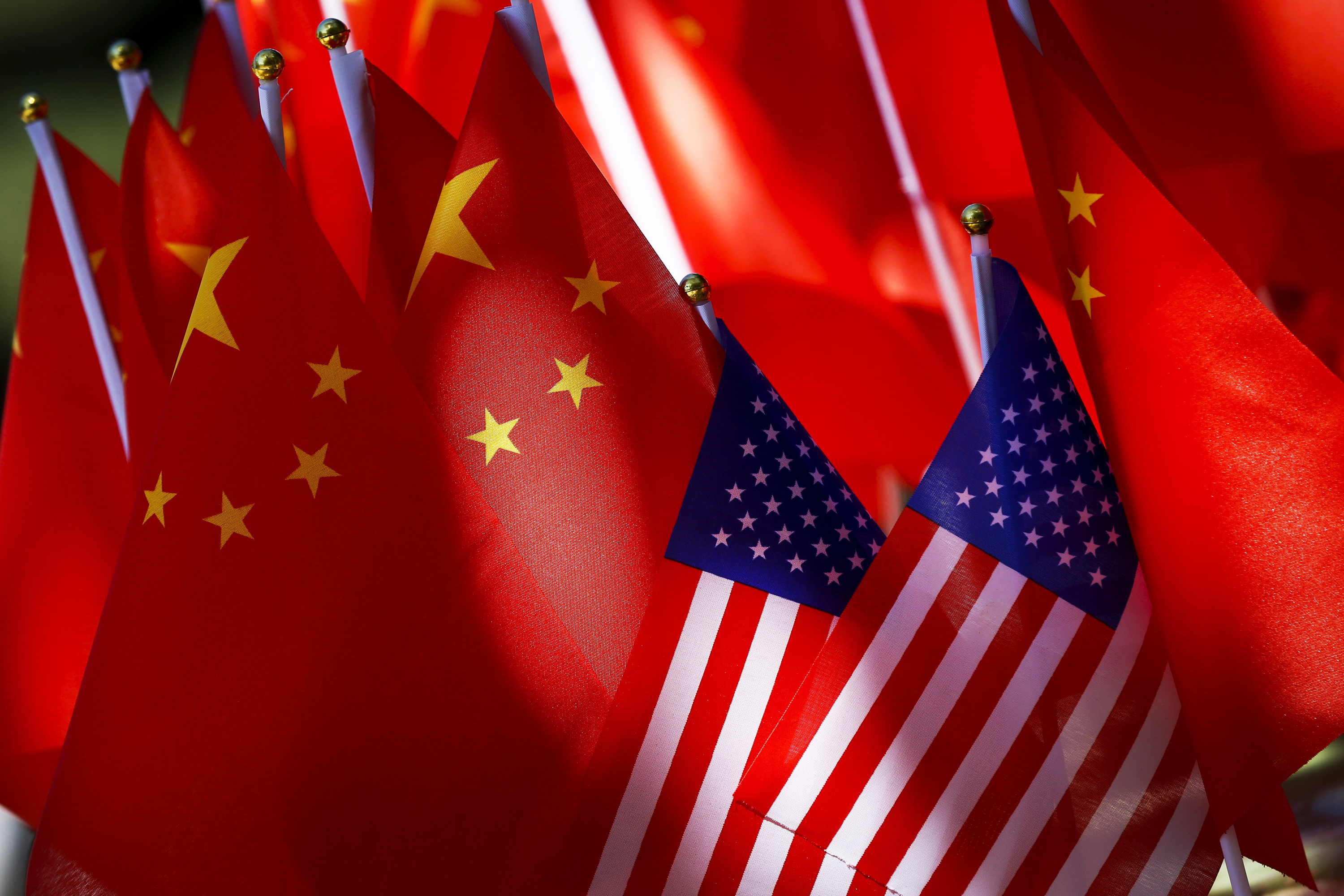 US and Chinese flags.