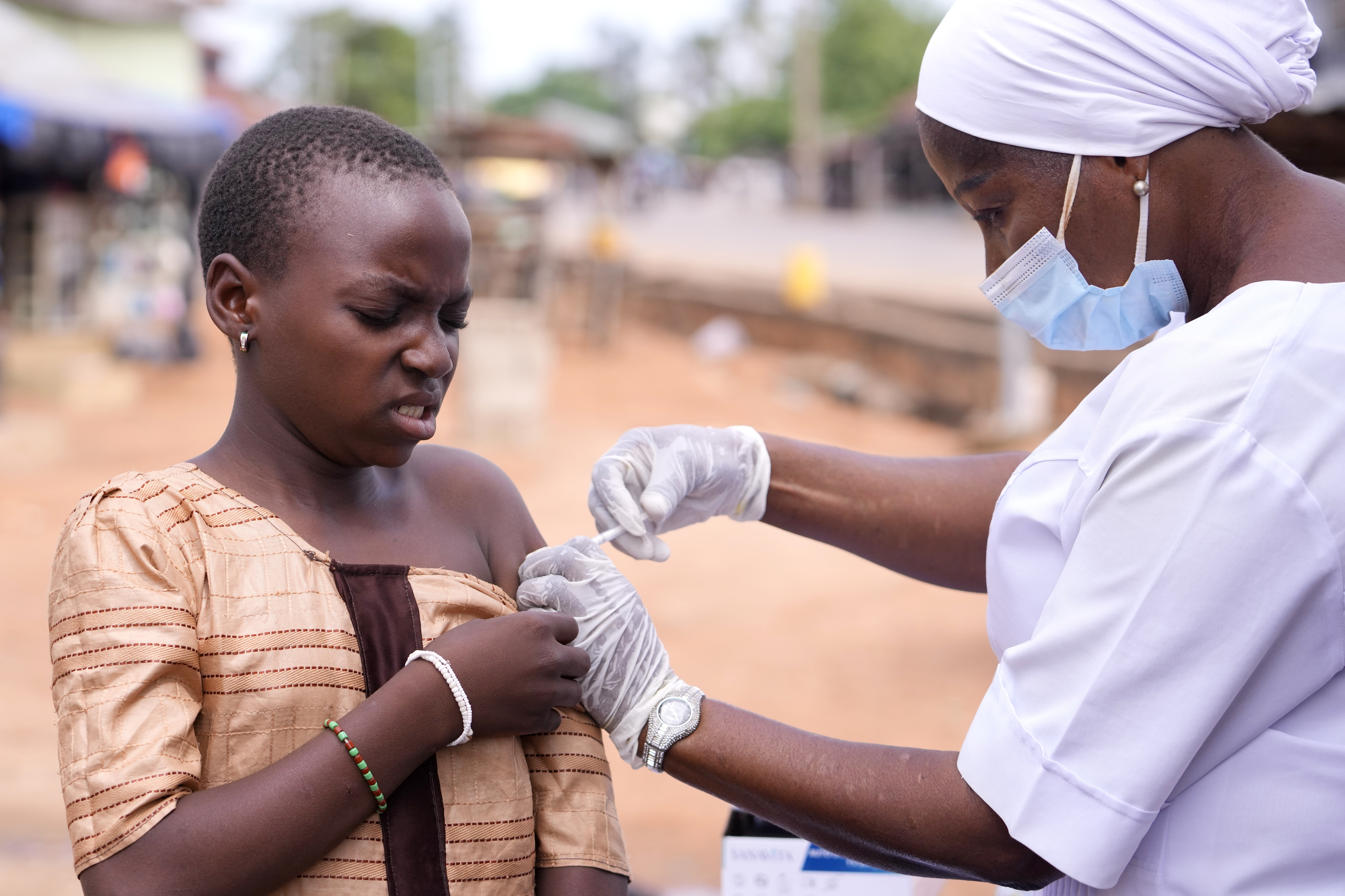 A health worker administers a cervical cancer vaccine, HPV Gardasil, to a girl on the street in Ibadan, Nigeria, on May 27, 2024