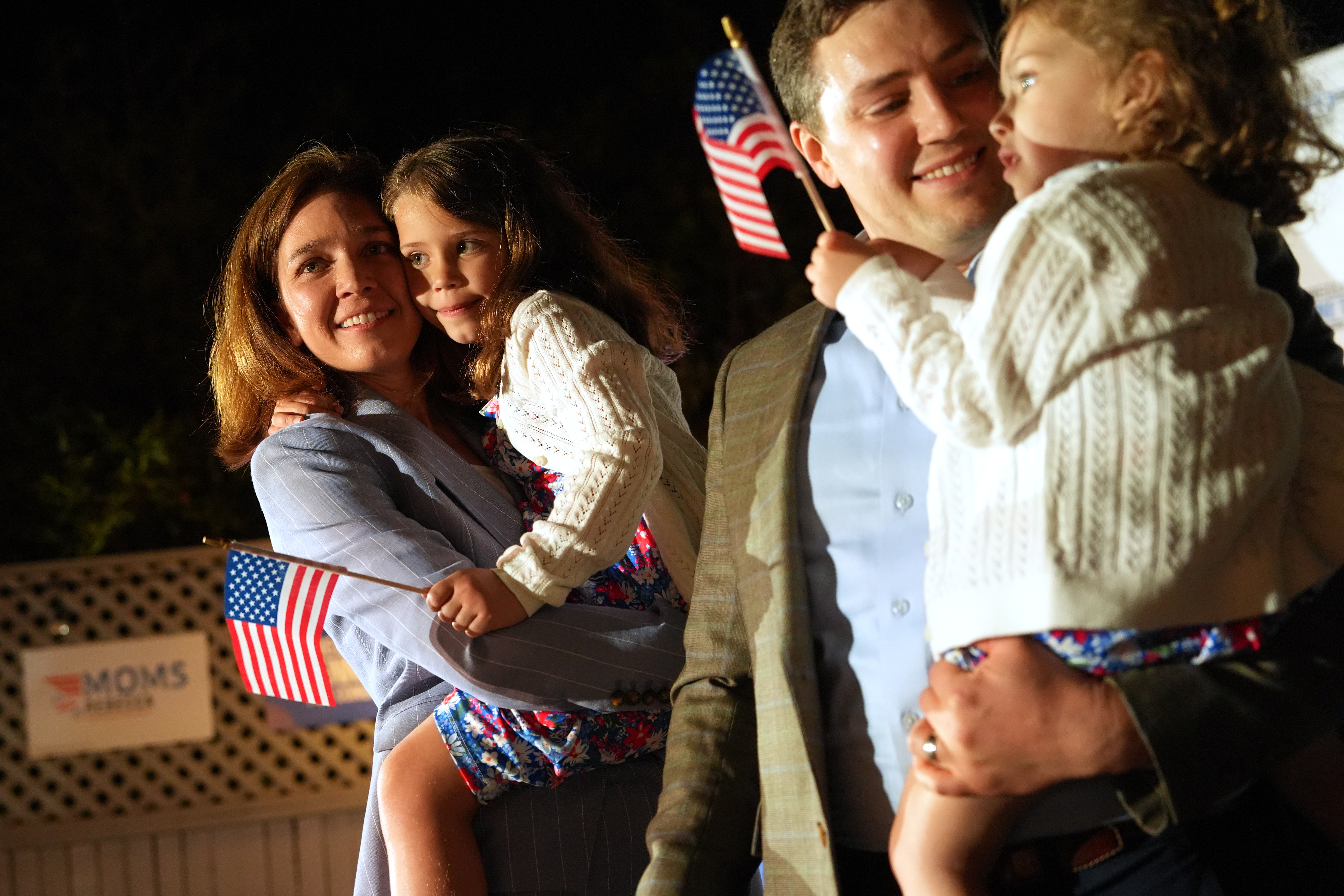 Rebecca Bennett, Democratic candidate for New Jersey’s 7th Congressional District, holds her daughter Rosie, alongside her husband Alex Hydrean and daughter Millie, at a primary election night watch party after winning the Democratic nomination Tuesday, June 2, 2026, in Bridgewater, New Jersey, the US