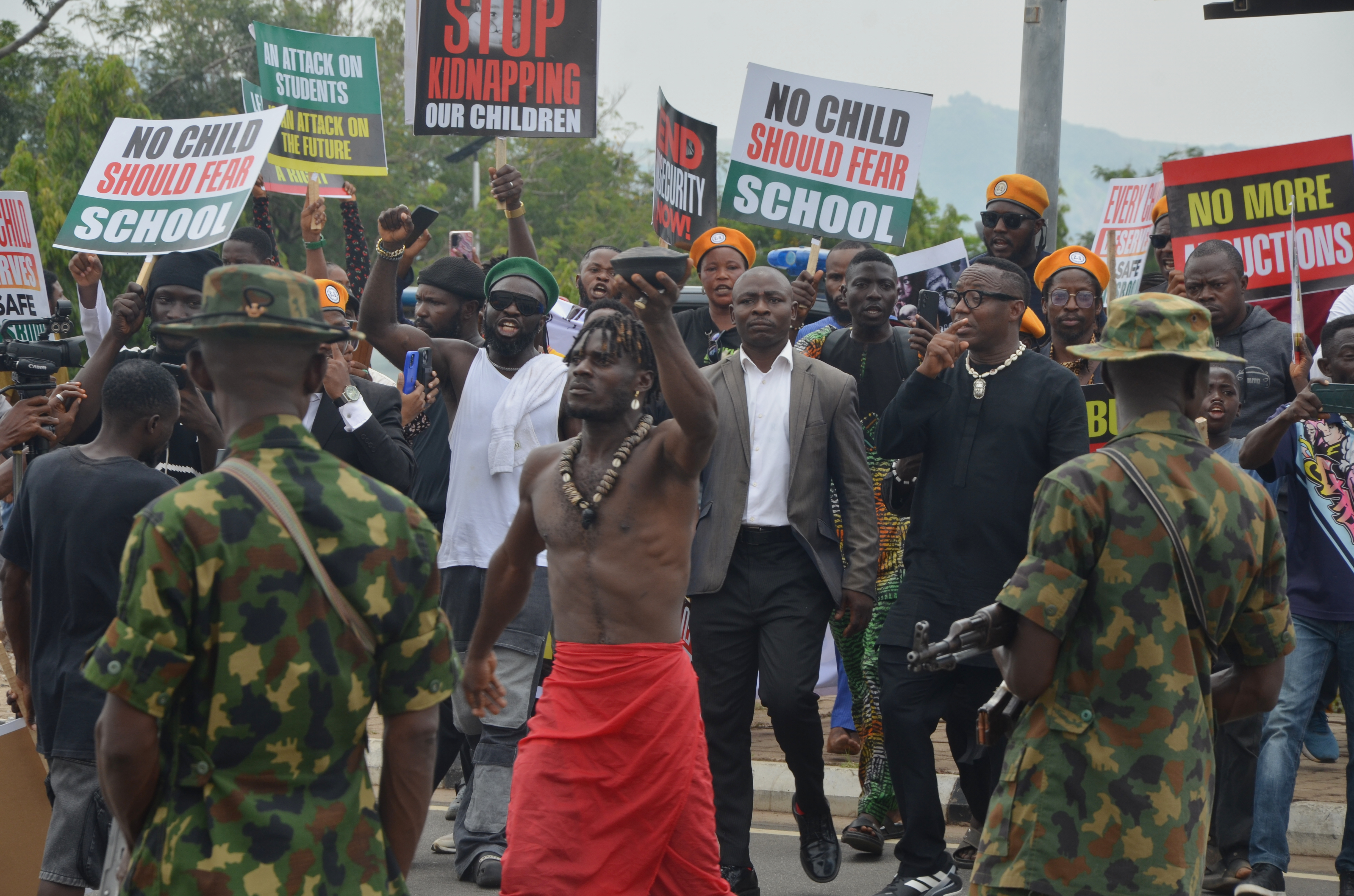People protest demanding government to rescue the school children that were recently kidnapped in various part of the country, on the street of Abuja, Nigeria. Thursday, June 4, 2026. (AP Photo/Olamikan Gbemiga)