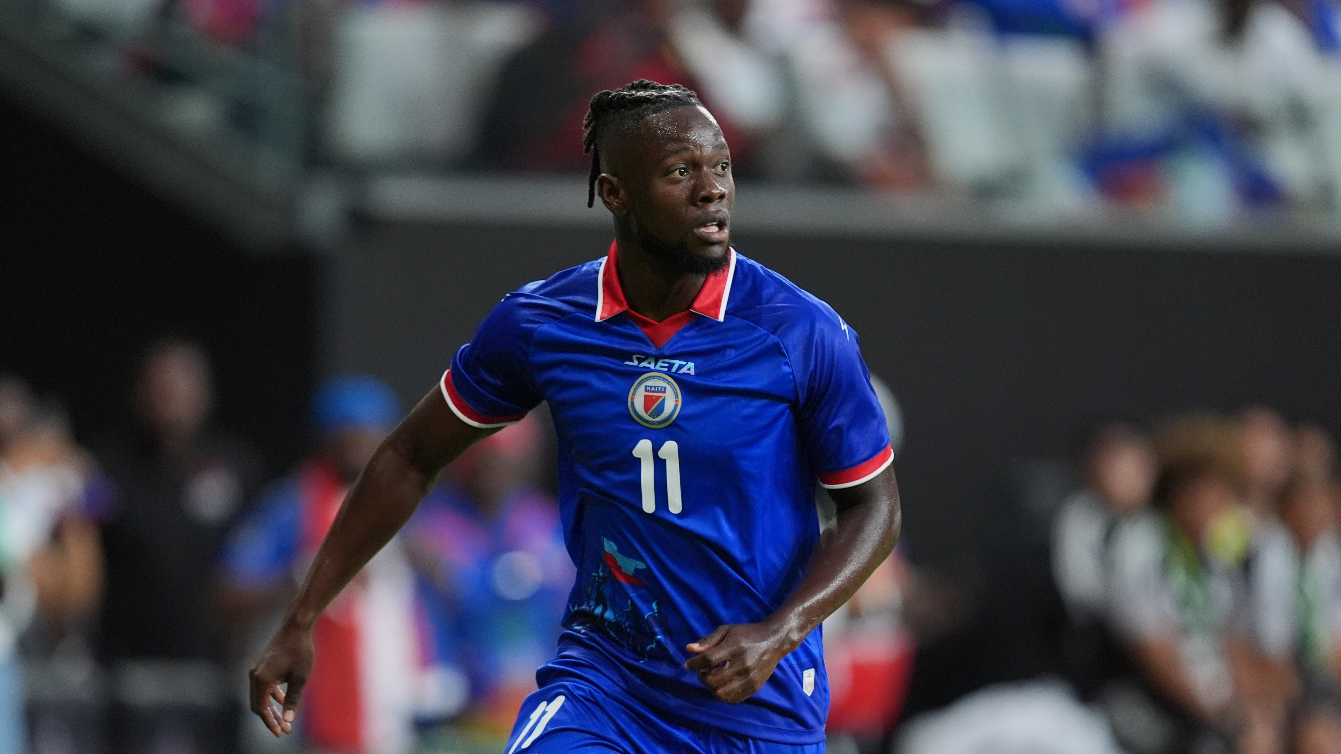 Haiti forward Louicius Deedson runs on the pitch during the first half of an international friendly soccer match against Peru, Friday, June 5, 2026, in Miami. (AP Photo/Rebecca Blackwell)