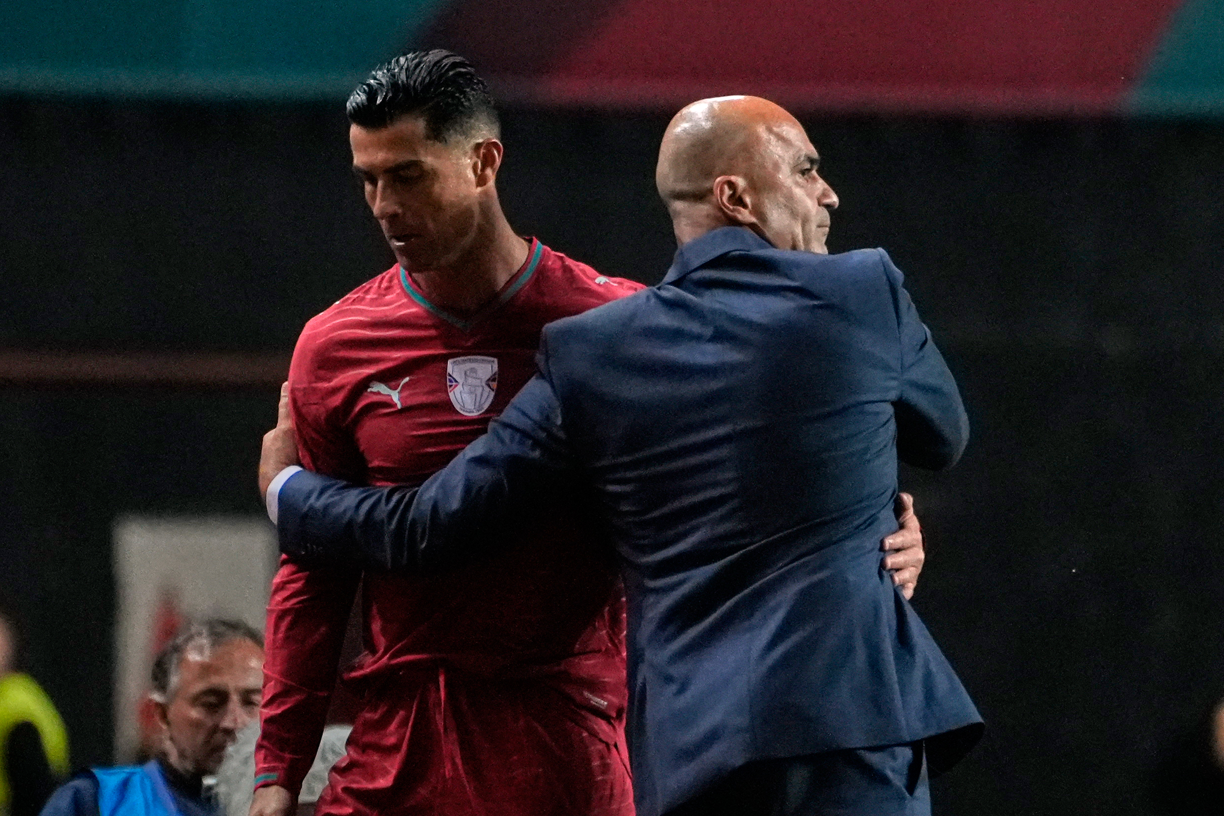 Portugal coach Roberto Martinez hugs Cristiano Ronaldo during an international friendly soccer match between Portugal and Nigeria