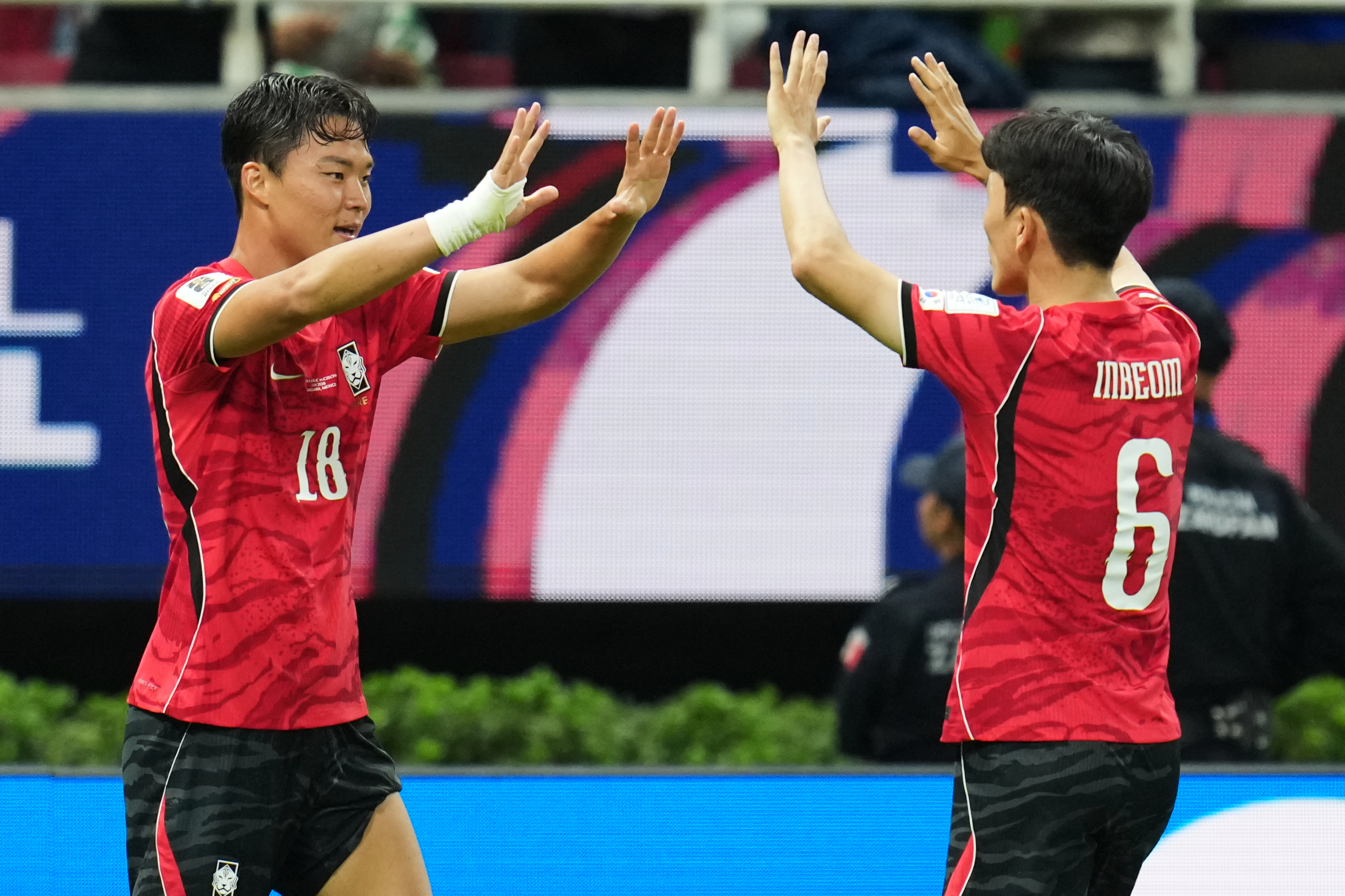 South Korea's Oh Hyeon-gyu, left, celebrates with teammate Hwang In-beom after scoring his team's second goal during the World Cup Group A soccer match between South Korea and Czechia in Zapopan, near Guadalajara, Mexico, Thursday, June 11, 2026. (AP Photo/Matias Delacroix)
