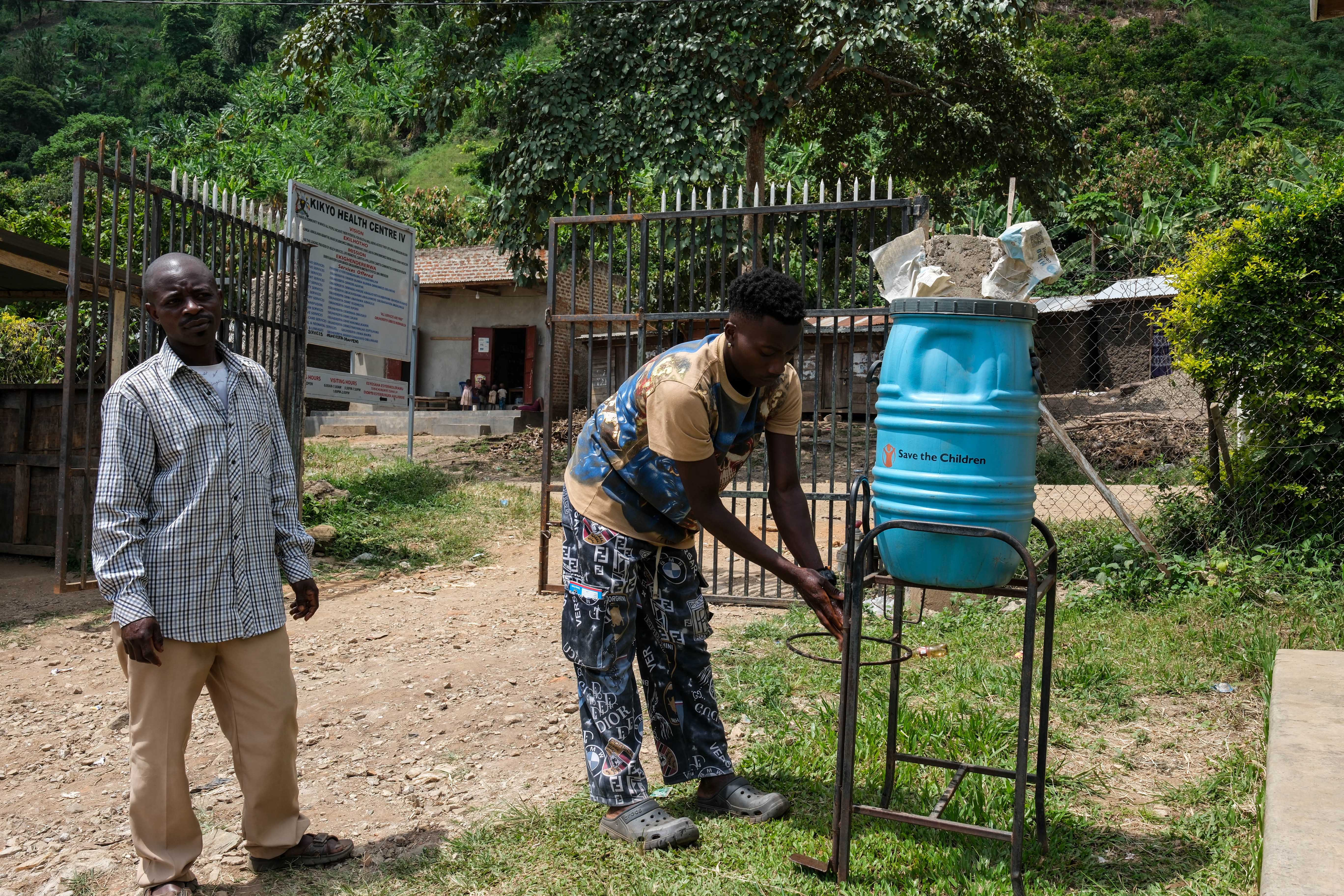 People wash their hands before entering Kikyo Health Centre IV in Kikyo Trading village, Bundibugyo District, Wednesday, June 3, 2026