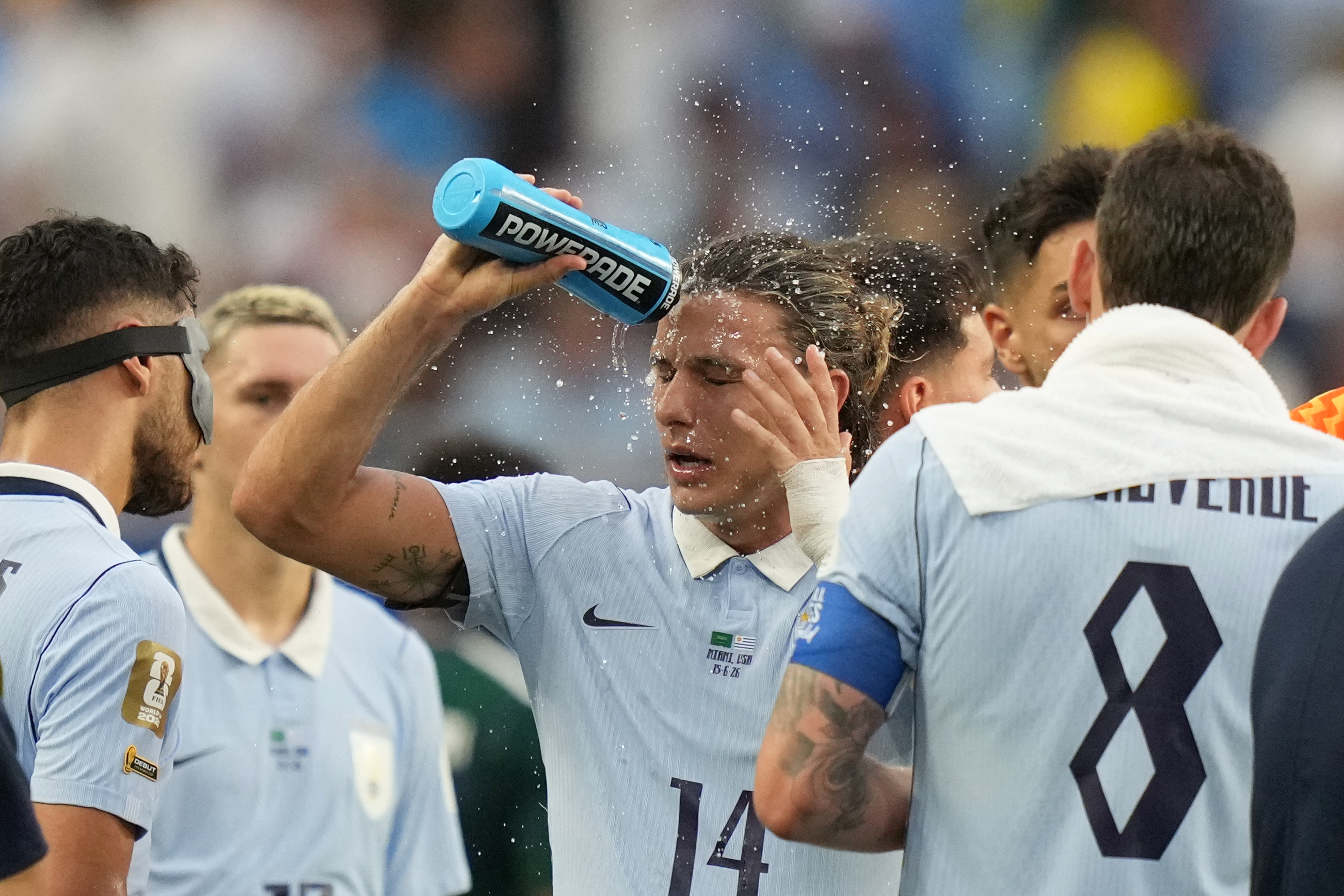 Uruguay's Agustin Canobbio cools off during a hydration break in a World Cup Group H soccer match against Saudi Arabia in Miami Gardens, Fla., Monday, June 15, 2026. (AP Photo/Lynne Sladky)