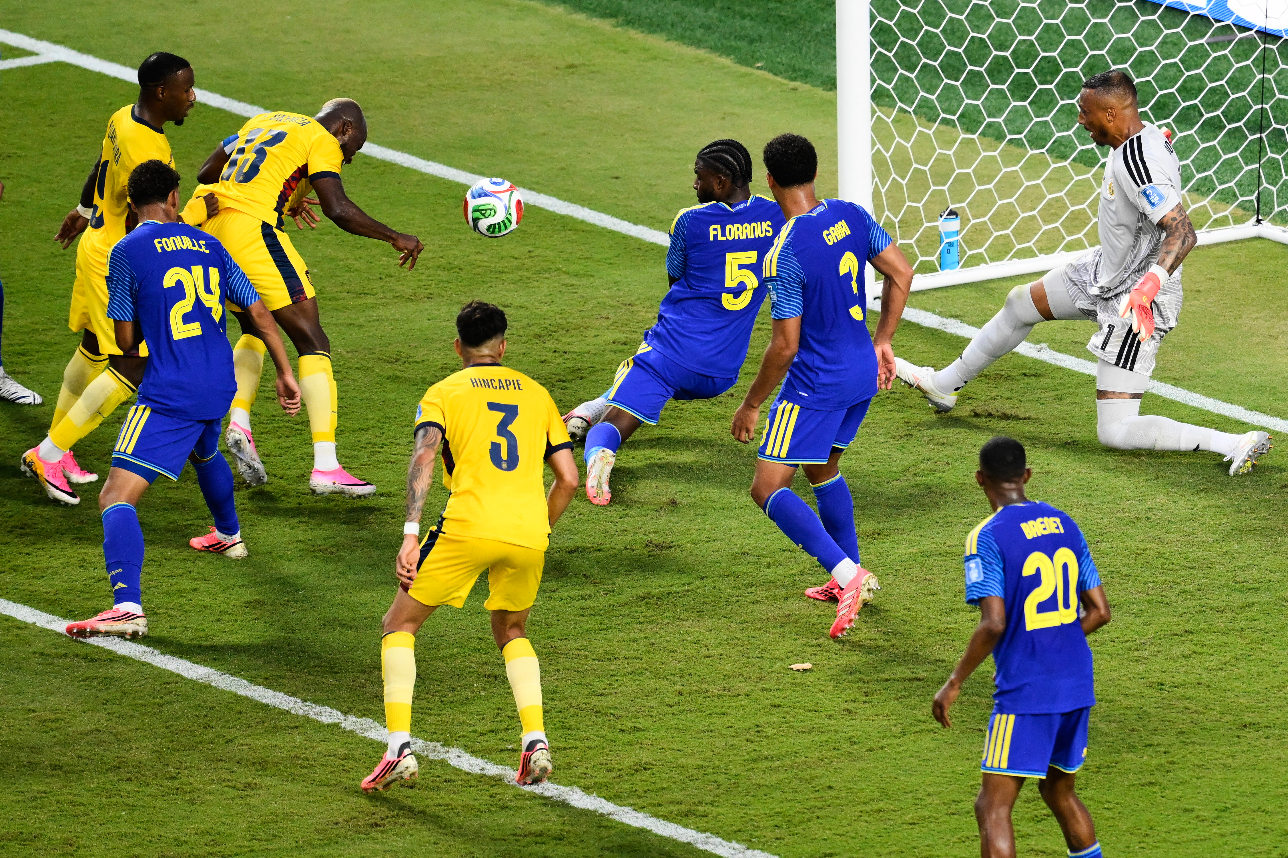 Ecuador's Enner Valencia (13) heads towards goal as Curaçao goalkeeper Eloy Room, right, defends during the World Cup Group E soccer match between Ecuador and Curacao in Kansas City, Mo., Saturday, June 20, 2026. (AP Photo/Reed Hoffmann)
