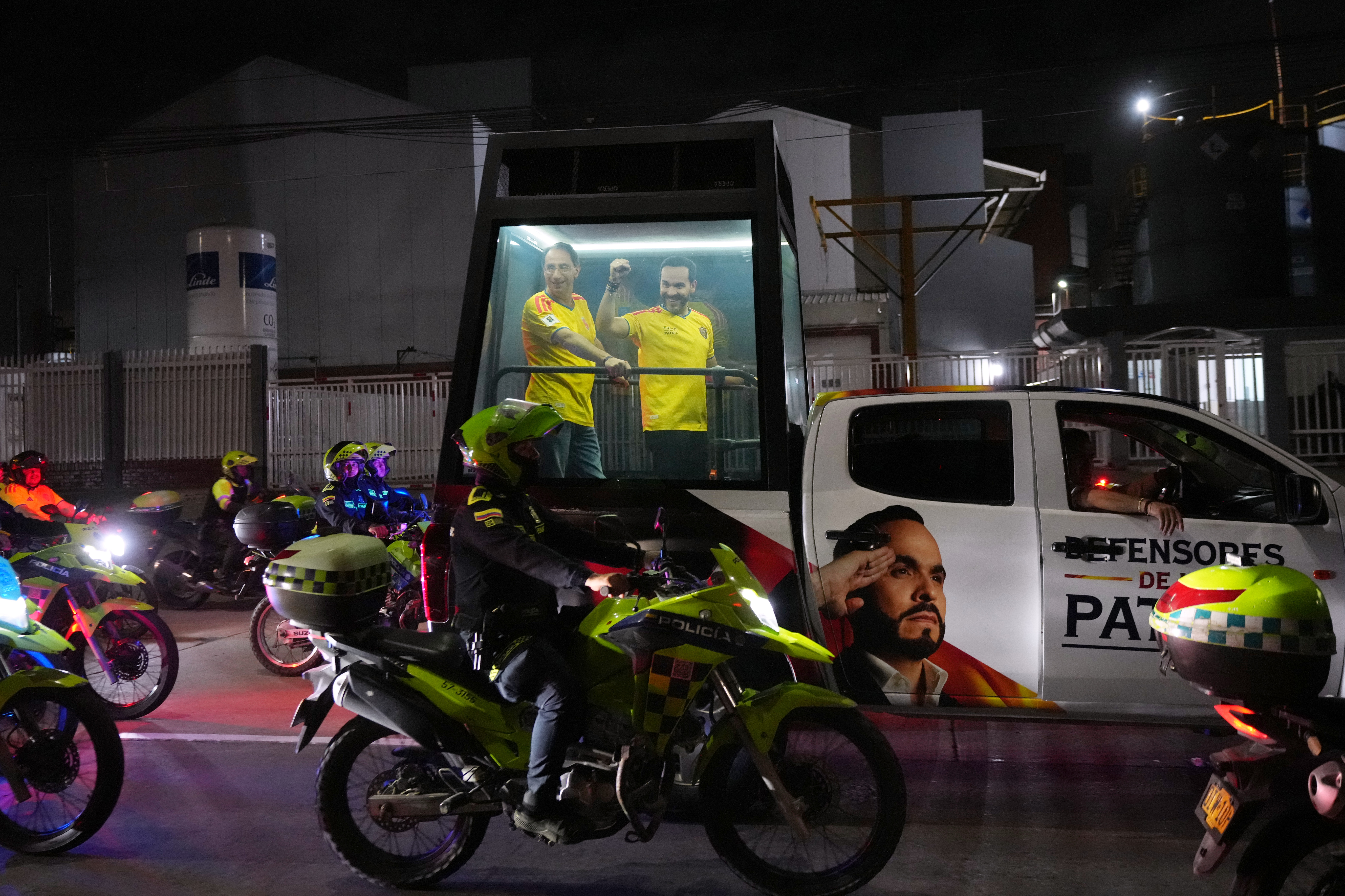 Presidential candidate Abelardo de la Espriella of the opposition Defenders of the Motherland movement and his vice presidential running mate, Jose Manuel Restrepo, ride inside a bulletproof enclosure towards a victory rally in Barranquilla on June 21, 2026