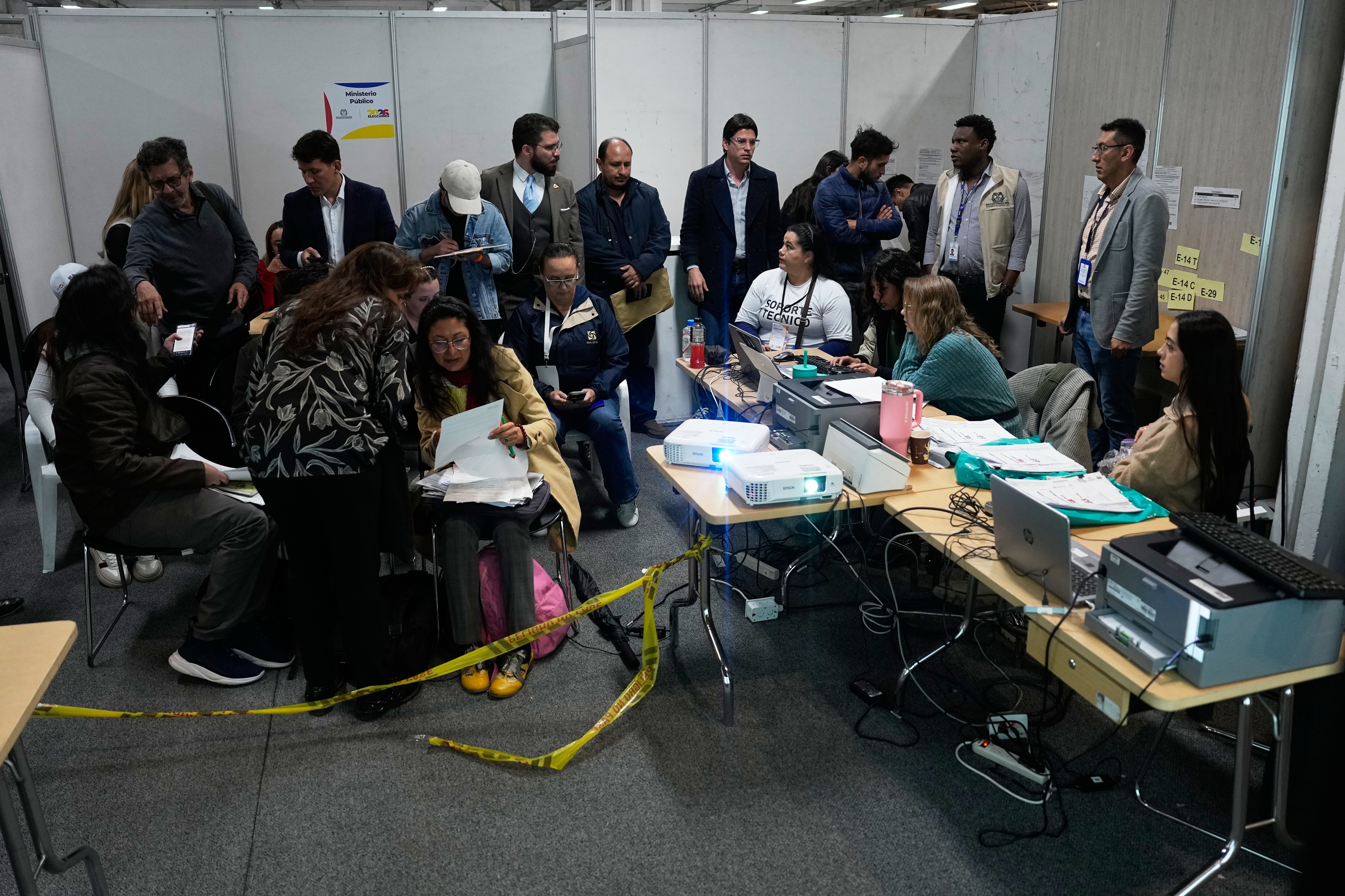 Electoral workers, observers and party delegates attend the official vote count the day after the presidential run-off in Bogota on June 22, 2026