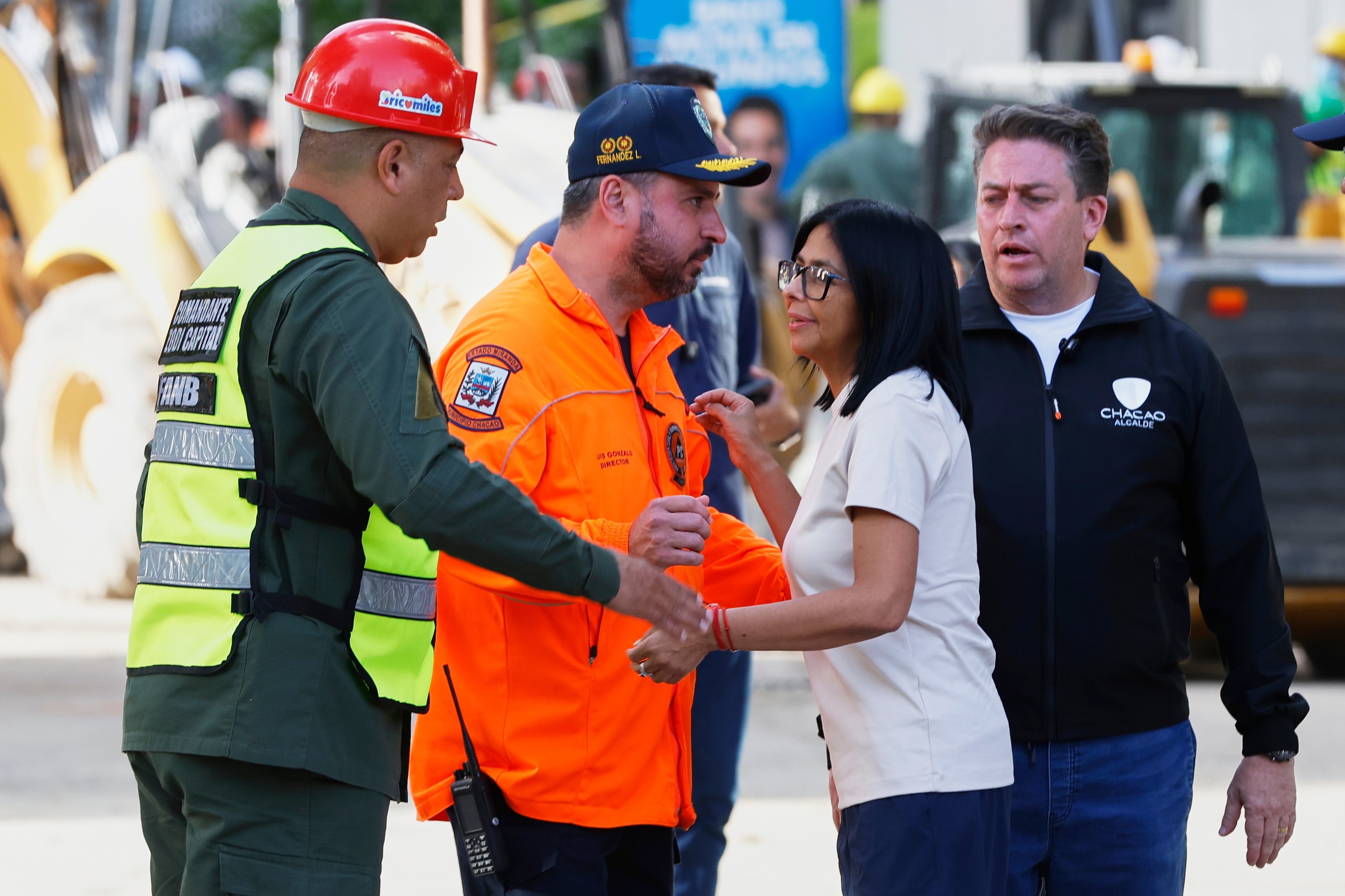 Acting President Delcy Rodriguez visits a quake-damaged area where rescue workers are searching for survivors in Caracas, Venezuela, Friday, June 26, 2026, two days after twin earthquakes struck the country. (AP Photo/Pedro Mattey)