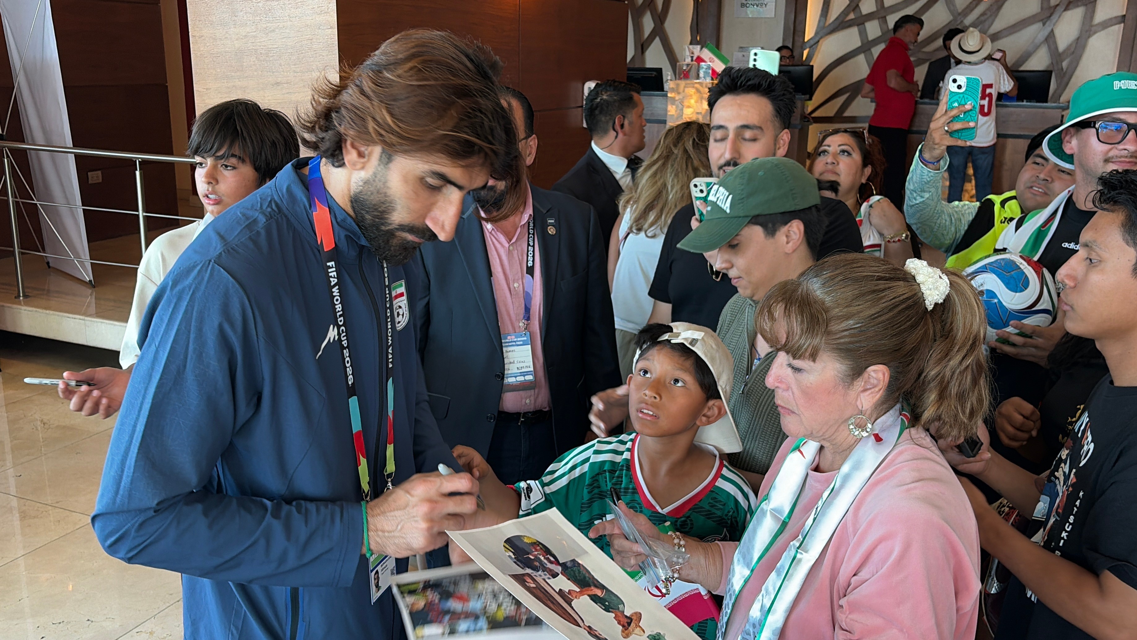 Iran goalie Alireza Beiranvand signs autographs for fans at a hotel in Tijuana, Mexico, on June 28, 2026 [Gabriela Aoun Angueira]