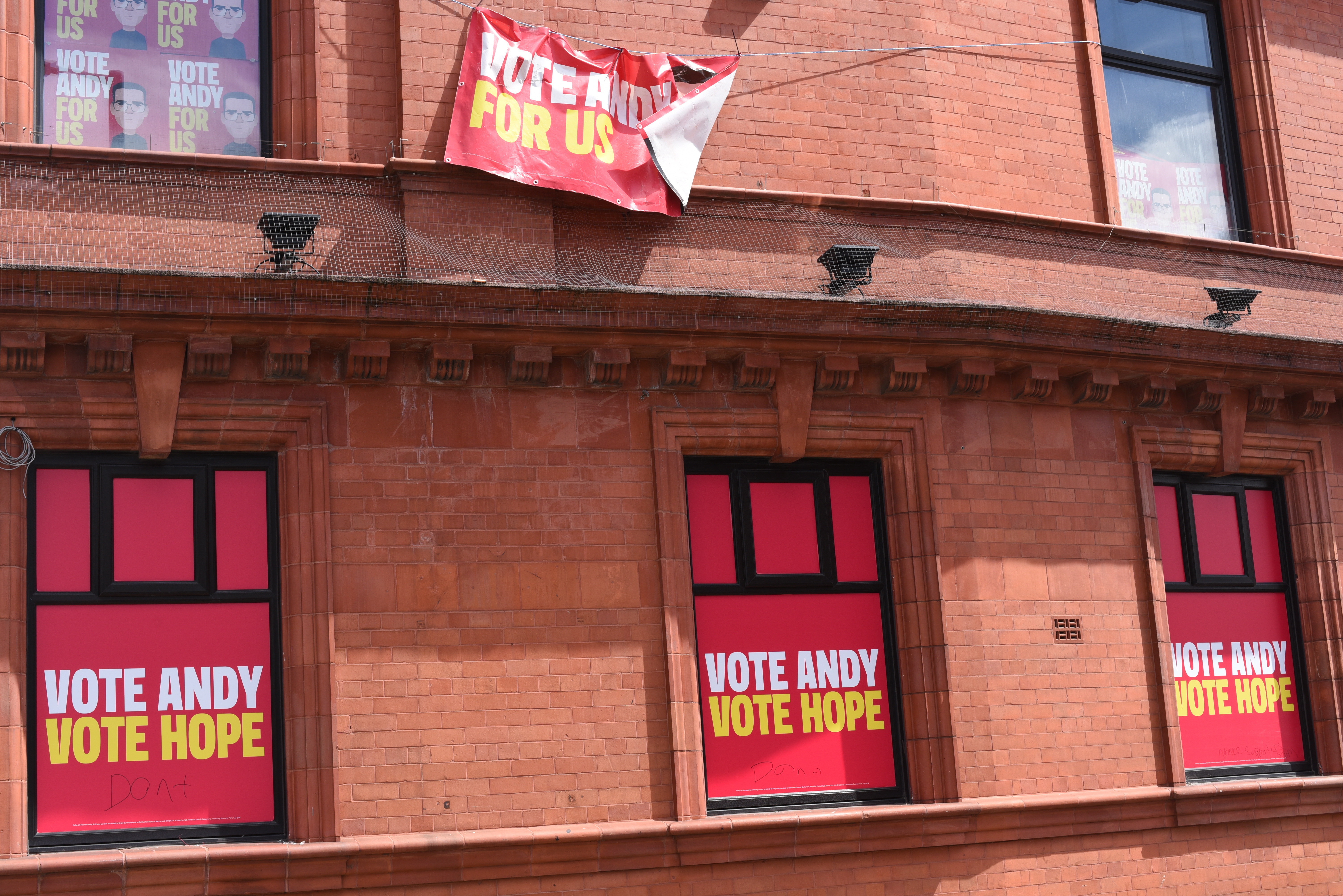 Andy Burnham’s posters are plastered over a pub in Makerfield