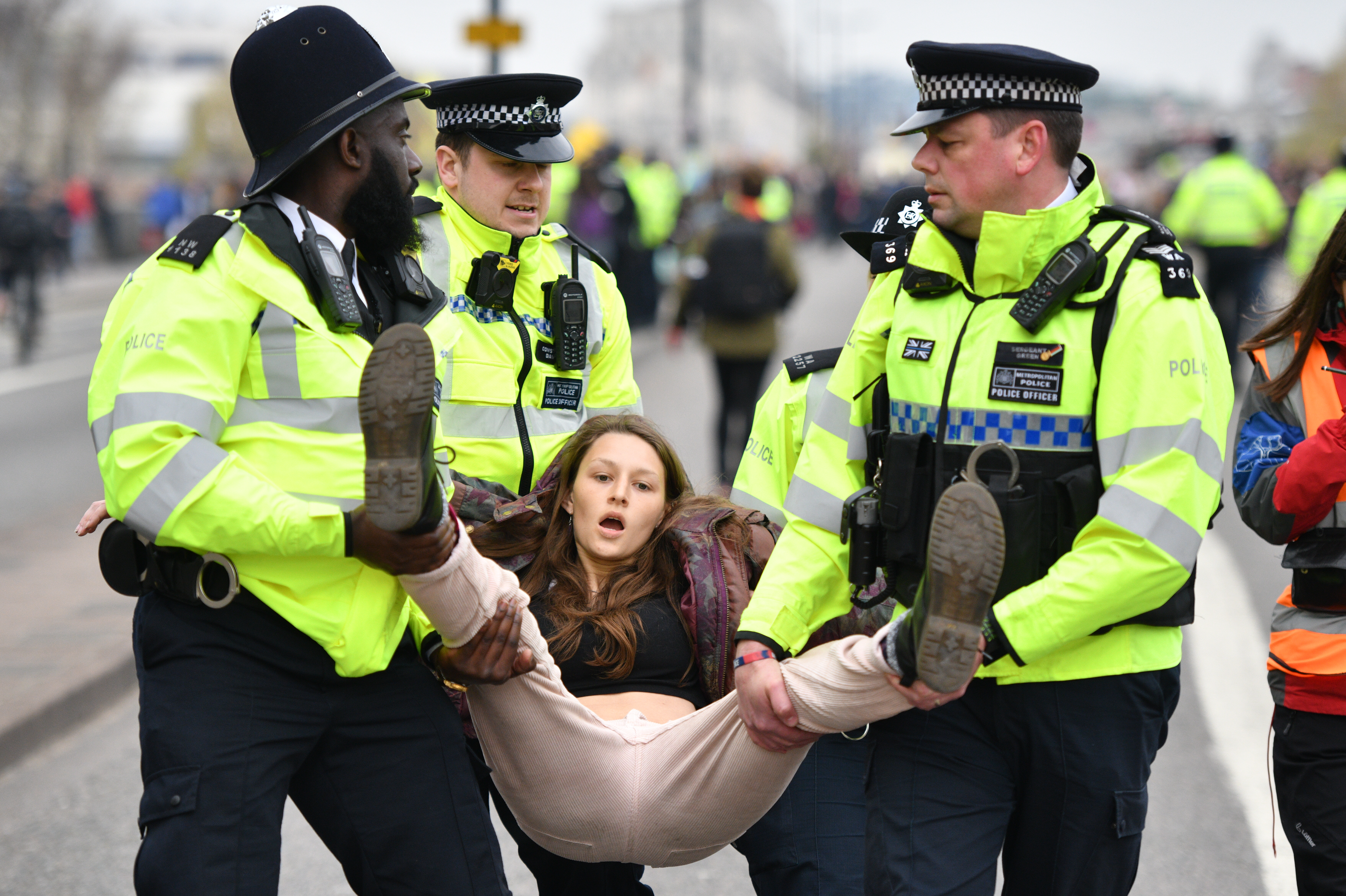 Police remove protesters from a blockade on Waterloo Bridge in London during the second day of a coordinated protest aimed at blocking key locations across the UK’s capital by the Extinction Rebellion group on April 16, 2019