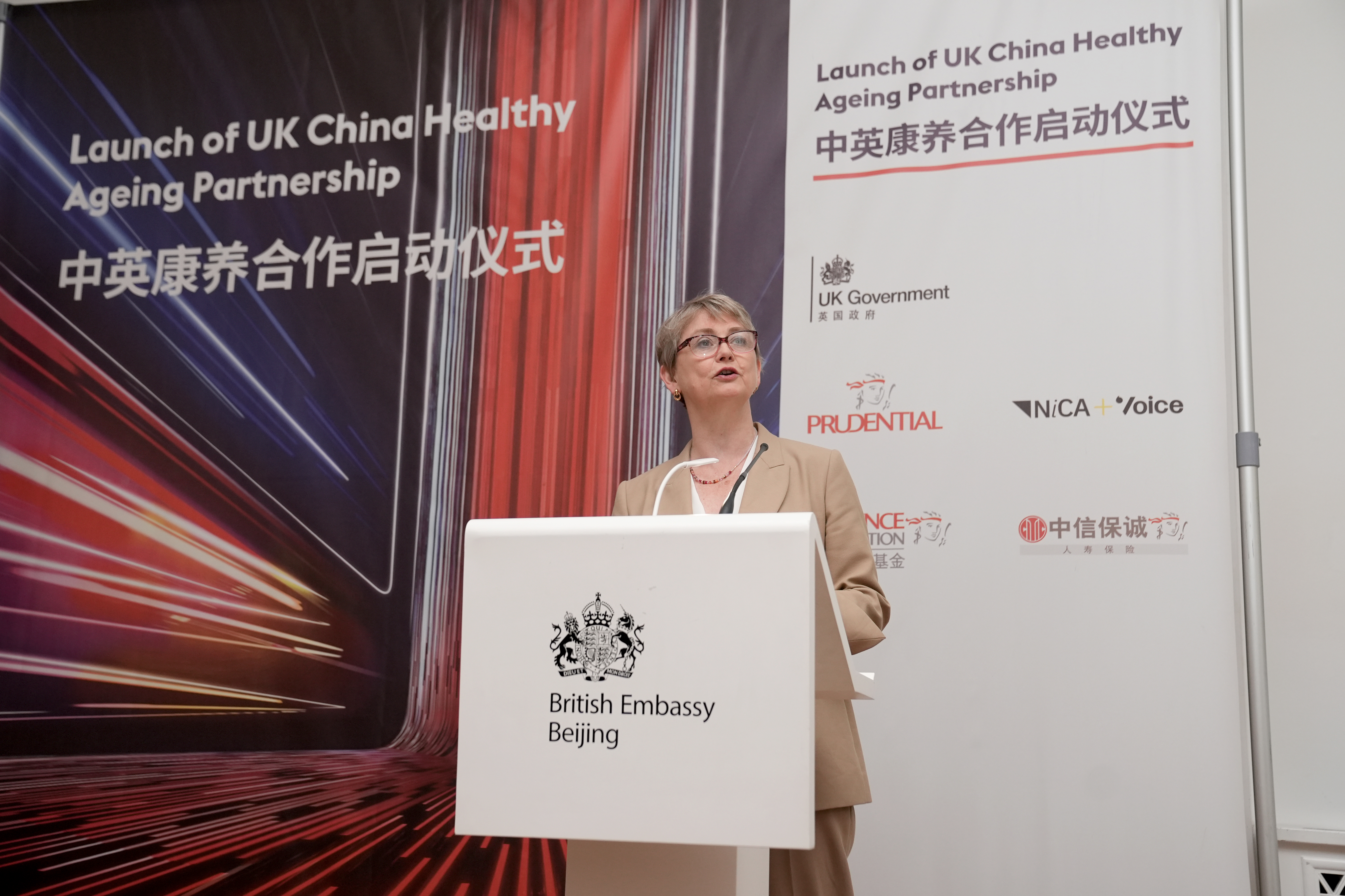 Foreign Secretary Yvette Cooper speaking at a lectern.