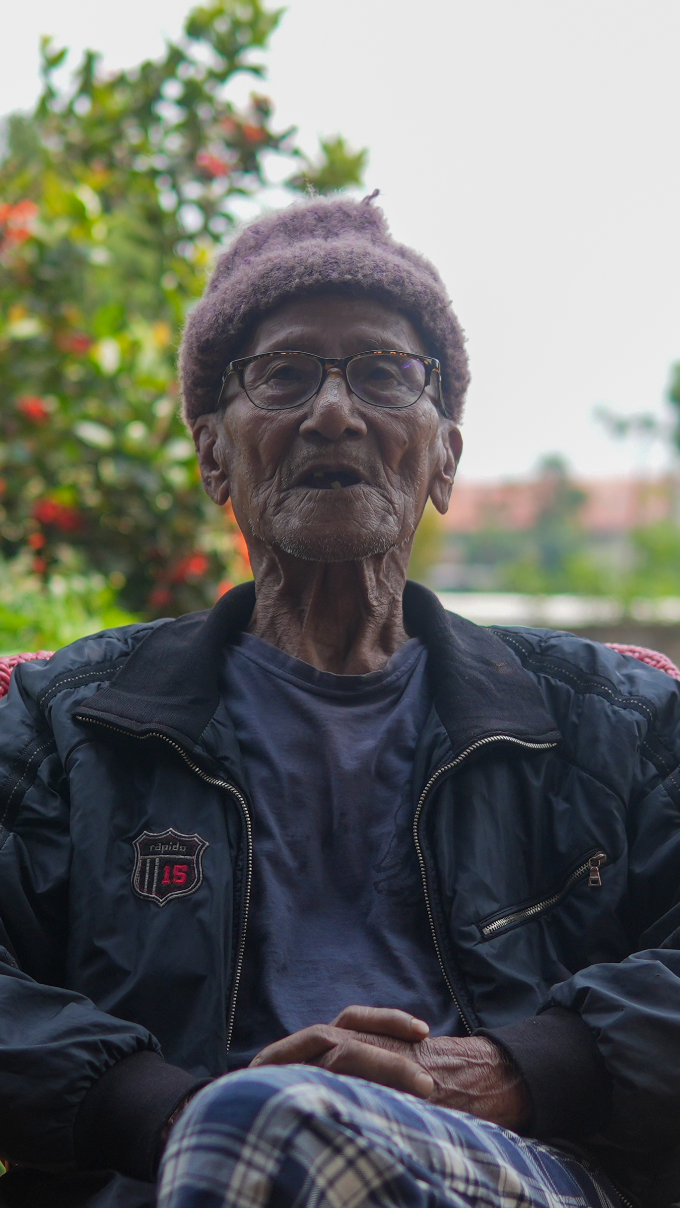 Kewstar Majaw, 92, remembers when niangtaser emerged throughout the village. Today, he says, their song is harder to find [Ashutosh Kumar/Al Jazeera]