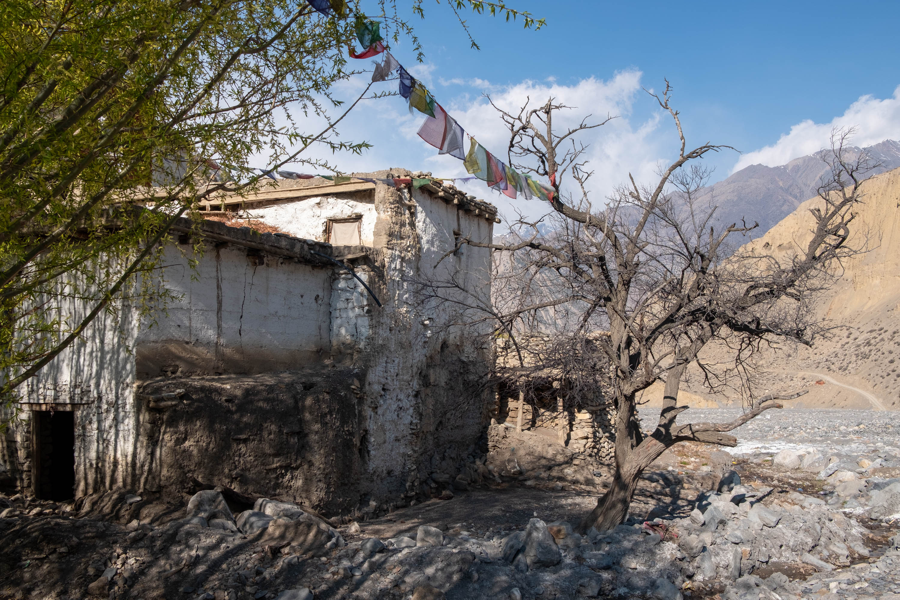 Homes alongside the river in Lubra now sit empty following disastrous flooding [Eileen McDougall/Al Jazeera]