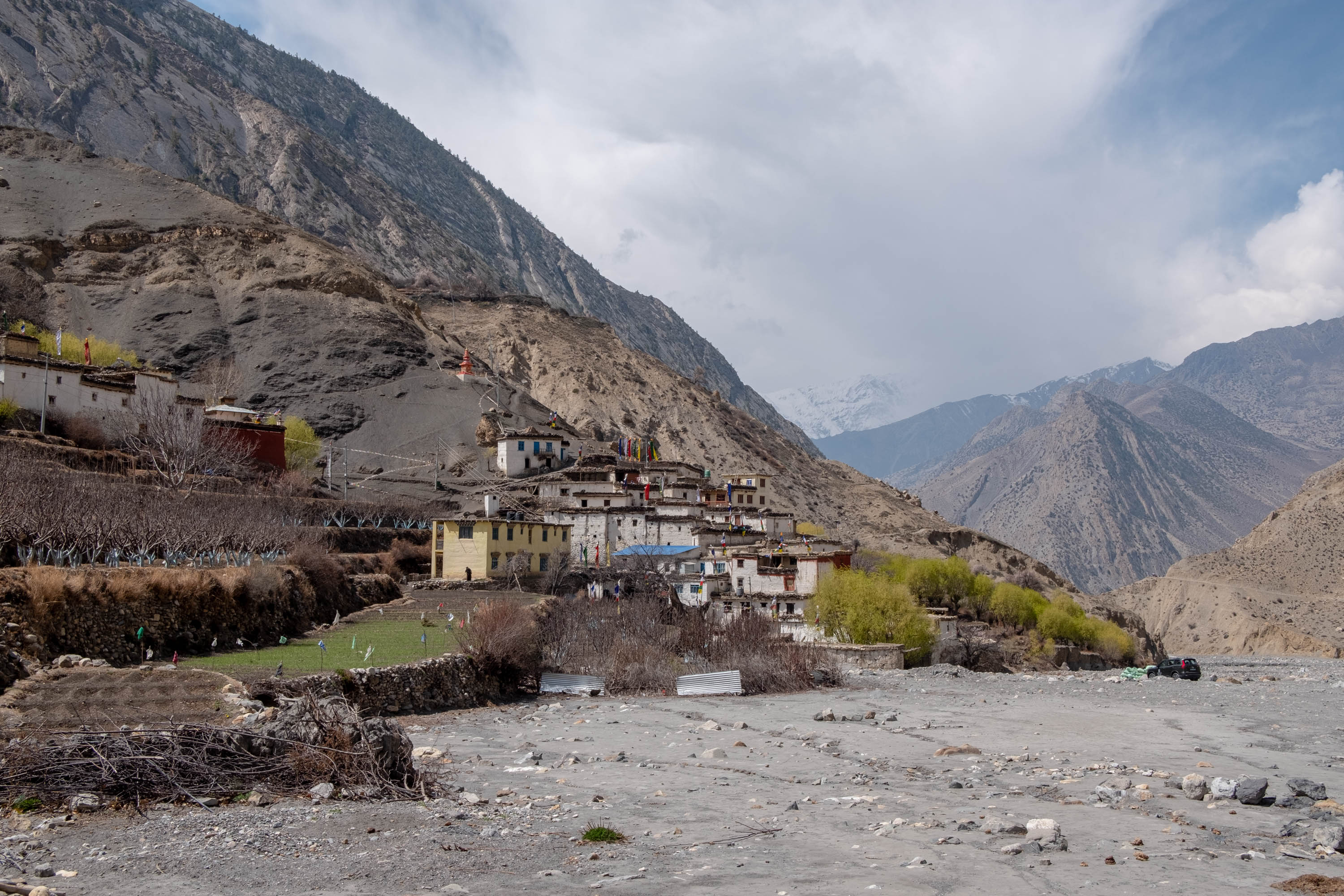 The village of Lubra seen from the distance along the riverbed [Eileen McDougall/Al Jazeera]