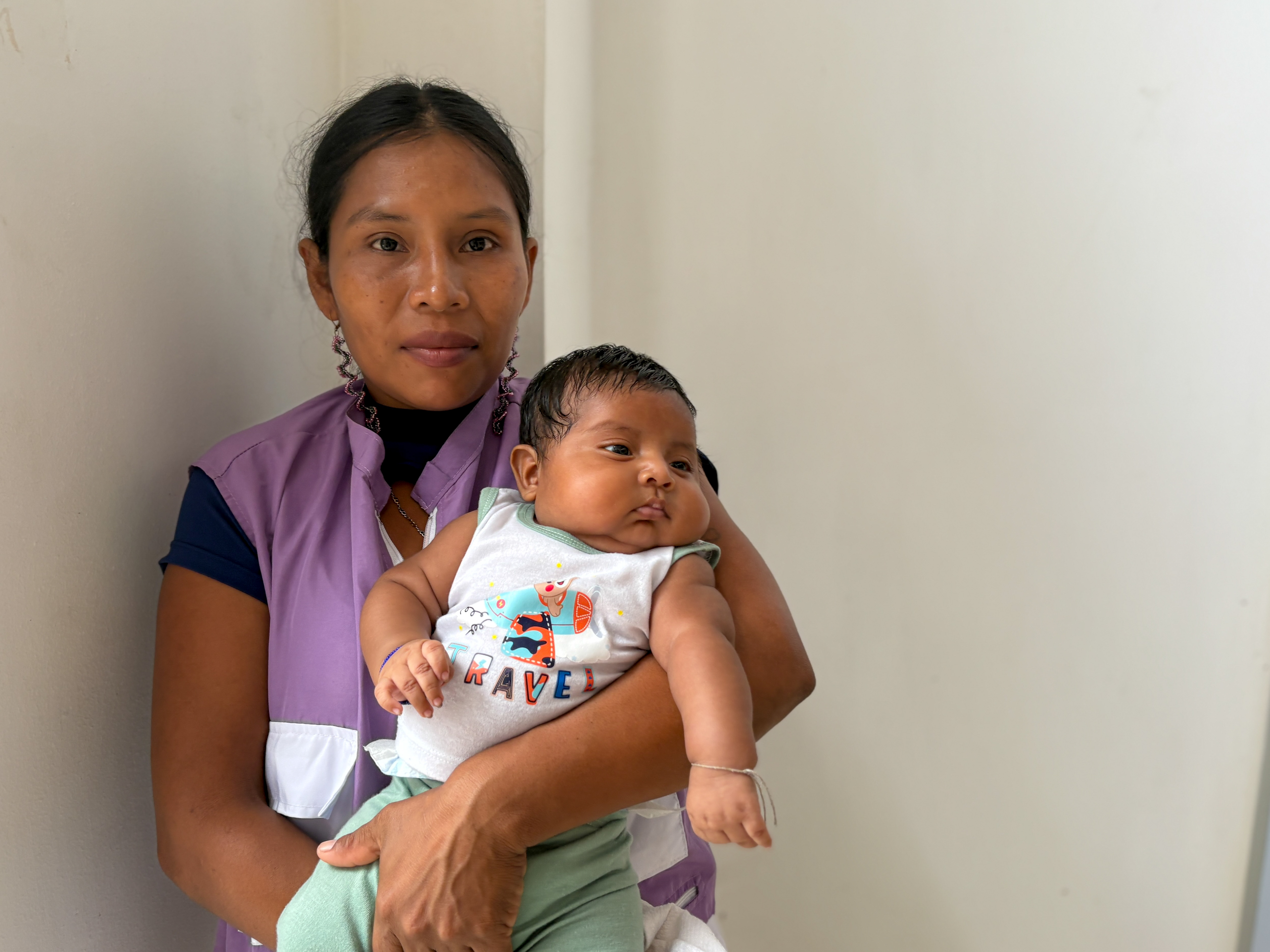 Midwife and regional coordinator Lucila Caizamo poses with her newborn baby